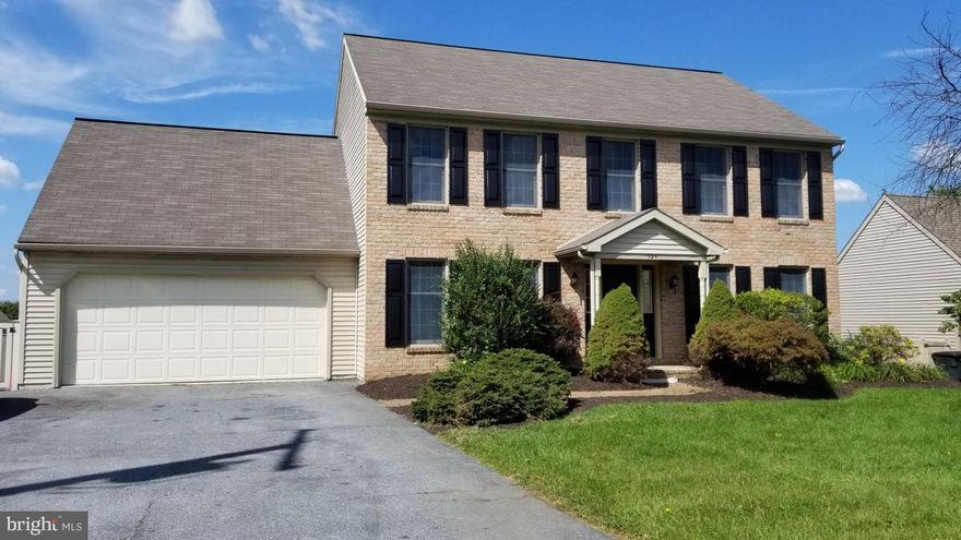 Traditional 2 story features new carpet, paint, appliances, lighting and more. Enjoy the sunny, open first floor design with access to the rear deck and fenced in back yard. Kitchen features stainless steel appliances plus island work station. First floor laundry and separate half bath complete the main level. Second floor main bedroom with private bath and walk-in closet, 3 additional  spacious bedrooms and main bath. The walk-out basement is partial finished with a gas fireplace and built in shelves.