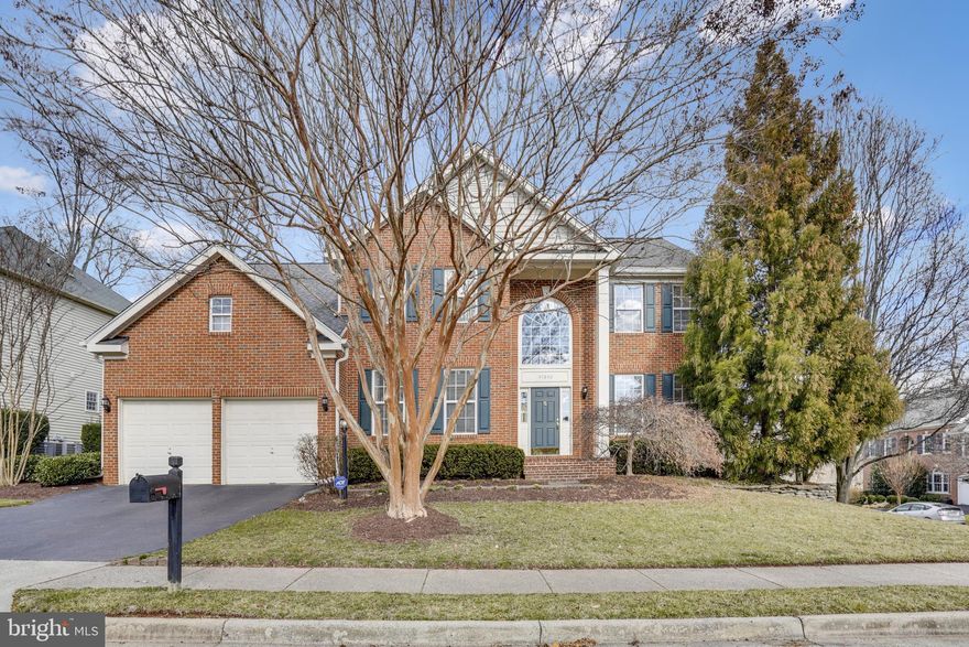 OPEN HOUSE 2/20 CANCELLED!  UNDER CONTRACT! Immaculately maintained, spacious brick front colonial in the highly sought-after Lowes Island neighborhood. This wonderful Madison model home welcomes you with a dramatic 2 story foyer and features over 4200 finished square feet. Fabulous floor plan for everyday living as well as entertaining. Special features include: Kitchen sunroom bump out! Shiny blonde hardwood floors in the foyer, kitchen, sunroom, powder room, mud room and stairs! Recessed lighting throughout! Custom chandeliers! Custom wood window blinds and draperies! Gourmet kitchen features a large center island, JennAir appliances gas range/cooktop, large refrigerator with pullout freezer, granite countertop, custom mosaic backsplash, walls of custom cabinetry and breakfast area. The kitchen opens to a spacious, sunken family room with gas fireplace. The sunroom bump out has walls of windows and access to the deck.  Easy flow between the living room and dining room for entertaining and when you need the extra long table for a large gathering! Main level study with French door is perfect for working from home. Sleek powder room with pedestal sink. Mud room with large closet is a welcomed place for the family outdoor gear and connects to the 2 car garage. 
The upper level boasts a spacious and light-filled owner's suite with cathedral ceilings and 2 large walk-in closets, - custom built-in cabinetry, shelving and hanging spaces in one of two closets. Primary bath features an oversize soaking tub, separate shower, picture window to let light in and separate room for the commode. Three additional supporting bedrooms on the second floor. Hallway bath features double sink vanity and shower/tub combination. Conveniently located laundry room features full size washer and dryer, shelves, cabinets and folding area and hall linen closet complete this level.
Walk-out basement with lots of possibilities, - in-law suite/au pair suite/home office! Recreation room with durable luxury vinyl flooring and access to the patio. Fifth bedroom with walk in closet. Full bath is accessible from the bedroom and main recreation area. Kitchenette features cabinets, sink, full size refrigerator and large closet. The basement is ¾ finished, the unfinished area includes a second laundry area, utilities, storage space and bump out for a future bedroom/office with private entrance.
Great outdoor spaces, - features a deck with pergola and ceiling fan off the sunroom with space for dining and seating areas for large social gatherings and stairs leading to a street level custom paver patio with built-in planters for a unique garden experience.  Located on the corner of a quiet cul-de-sac, adjacent to a private golf course. Enjoy the Cascades community way of life, - amenities includes 5 community centers, 5 swimming pools, 15 tennis courts, 25 tot lots, a bocce court and a soccer field, and trails! Close by parks include Algonkian Regional Park which has riverfront access to the Potomac River along with a boat launch, 18 hole golf course, mini golf, rental cabins, and a picnic area. Convenient to routes 286 and 7, restaurants, shops, parks and schools.. Recent upgrades include Roof-(2019) and HVAC (2017).