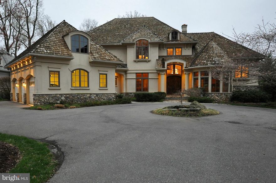 6440 sqft 4-lvl architectural treat w/10' ceilings, hrdwd floors, soaring windows, custom built-ins. Gourmet kit w/custom cabs, eating bar & morning room. Prvt master suite w/cork flrs & gas fireplace. Huge BRs with en suite bathrooms & 9' ceilings. 4 game rooms, home gym, multi-tiered projection home theater. Prvt secure gated community, walk to pool & tennis. HD video tour & 400+ photos avail.