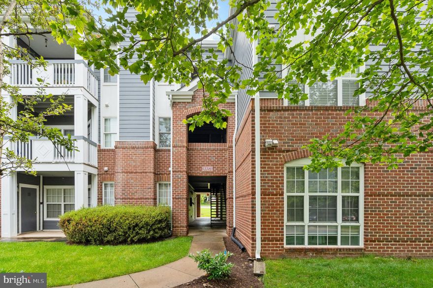 Eligible for FHA Financing. This upscale 2-bedroom condo Is located in a quiet community surrounded by tall shade trees, with easy access to the community pool and clubhouse with all the owner’s amenities just a few steps away. Relax on your private covered deck just steps away from walking paths, a perfect for walking pets and enjoying the outdoors. Stepping inside, you’re greeted with a natural light filled open floor plan with a gas fireplace with mantle anchoring the cozy living room and dining space. Enjoy your updated kitchen with granite counters, gas stove, stainless steel appliances, and breakfast bar. Your new home is conveniently located within walking distance to George Washington University Campus and One Loudoun. Enjoy nearby Bles Park and the Potomac River. Explore the Saturday Farmers Market, bars, restaurants, Alamo Draft House and other fun amenities. Travel via Dulles Airport is an easy 15-minute drive. Come see this amazing home and make it yours. Eligible for FHA Financing. Ample unassigned parking. Condo fee includes water and trash.