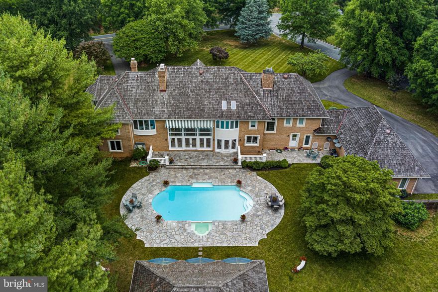 Welcome to 8812 Mary Mead Ct.  1% Rate Buy Down No Additional fees for BUYER 
Potomac Living at its Best! - This Stunning 4-sided Brick Manor Home Nestled in the Legendary Falconhurst Neighborhood, surrounded by A Natural Oasis that's Teeming with an Array of Rare Birds and Wildlife. As you approach The Home's Circular Driveway, You'll Immediately Feel A Sense of Privacy and Exclusivity.
Upon Entering The Home's Double Mahogany Doors, you'll be greeted By A Breathtaking Custom Staircase that was Once Featured in Architectural Digest. The Grand Foyer Boasts Soaring Ceilings and Marble Floors, setting the tone for the Enchanting Design and Style that permeates every inch of this home.
As you make your way through The Main Living Area, you'll be struck by the Abundance of Bright Natural Sunlight and Designer Finishes that Dazzle the Eyes and the Heart. The Expansive Great Room Seamlessly Flows into the Glamorous Kitchen, which features Top-Of-The-Line Appliances from Wolf, Dacor, Subzero, and A Custom Viking Double Oven. The Large Dining Room Offers Direct Line Views of The Impressive Landscaping. This Home Features A Wing Dedicated to Entertaining on a very large level which includes one of the largest butlers pantry in the DMV and an extra large extra wide 4 car garage.

This Gracious Home also Boasts One Of The Largest Fully-Paneled CEO Office with Custom Brass inlay in the Brazilian Cherry Flooring. As you head up The Grand Staircase, you'll find The Most Luxuriously Appointed Primary Suite, Complete with an Enormous Sitting Room, 6 Unbelievable Closets, and a Spa-Like Bathroom with a Large Jacuzzi Tub that Offers Stunning Views in Every Direction.
But The Real Showstopper is The Enchanting Backyard with Extensive Hardscaping and Landscaping Designed By A Renowned Landscape Designer. The Massive Multi-level Patio Features Three Shaded Areas with A Pool and Pool House Complete with Living Room, Kitchen, Full Bathroom and Separate Changing Area. The Fully Fenced Backyard Provides Privacy And Security, while the 12-zone Sprinkler System Ensures The Landscaping Remains Lush and Green. Additionally, The Home has 800 amps of Electricity and A Commercial Grade Gas Generator. The Newly Finished Walk-up  Basement Offers An Expansive Space Perfect For Entertaining with a Home Theatre and a Real Gym, as well as In law Suite with Full Bath. Impressive Storage Rooms Provide Ample Storage Space For All Your Needs. Huge unfinished area over
4 car garage can also be easily converted into maid's quarters, large gym or bonus space.
8812 Mary Mead Ct, the epitome of elevated living for those who've always sought the extraordinary. Perfectly positioned in the prestigious Falconhurst, Potomac, MD, this grand home is a testament  of superior new construction paired with unmatched elegance. Designed especially for the Bon Vivant with a penchant for world-class luxury, this home offers 5 lavishly-appointed bedrooms, a lavish outdoor patio seamlessly transitioning to a sprawling 2 acres of perfectly manicured landscaping— setting the stage for a life of unparalleled outdoor entertaining.
. Sunlight streams through vast windows, casting a shimmering glow on the hand-picked finishes that add splendor to every nook and cranny.
At its heart lies a gourmet kitchen, intricately designed for those who find pleasure in the gastronomic arts. Every detail, from the bespoke cabinetry and cutting-edge appliances to the timeless  beauty  has been tailored to inspire culinary wonders. Whether curating an intimate dinner or hosting a grand soirée, this space is your stage.
This Extraordinary Home is shown By Appointment Only, so don't wait - Schedule Your Private Tour Today and Experience The Very Best of Elegant Living!1