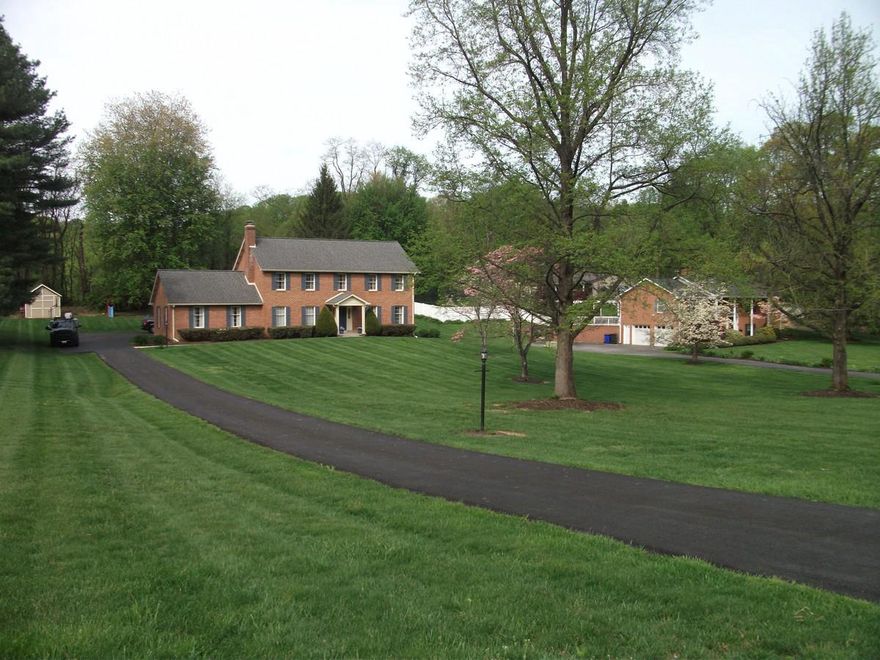 No HOA and no water/sewer bills! Custom-built Ausherman Colonial on 1.29 acres in very private Hillside Estates, backs to 25-acre farmette. Features 4BR, 2.5BA with 3 living areas (Formal Living Room, Fireplace Room, Family Room) with connecting walkout in Basement.  Fireplace Room features Beautiful Built-Ins.  Hardwood floors on main level, All-Electric, Stainless Steel kitchen, and Main-Level Laundry with Laundry Chute.  Flexible layout with space for home offices and plenty of Built-In Storage. Huge Front Yard and Large Backyard with Shed and Swing Set. Convenient to interstate and shopping while offering a private, peaceful setting. New HVAC (2025), 50 Year Roof (2013), Driveway Resurfaced (2022) and Seal-Coated (2025), Septic drained (2025). No garage. Only 2 owners. Prefer Olde Towne Title. Listing Agent is the Seller.