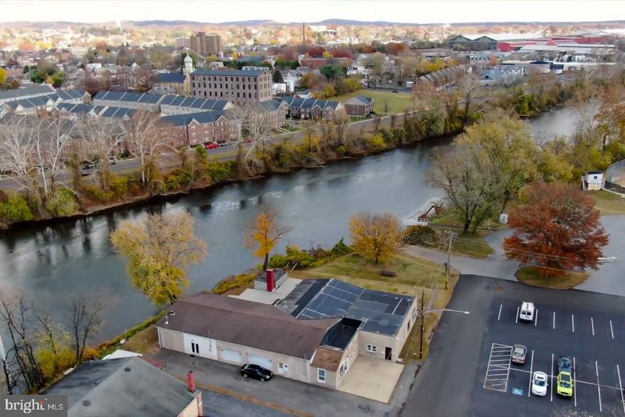 Prime Industrial Building For Sale along the Schuylkill River in Chester County, PA with 1,600 sq. feet of indoor retail space and unlimited outdoor seating space!  This location neighbors baseball and pickleball fields and basketball courts, there is a tremendous amount of community awareness!    Consider the plans on file for a multi-story condominium building with stunning views of the Schuylkill River just minutes from the revitalized town of Pottstown which offers easy access to local amenities, transportation and it's a growing community with a strong demand for modern housing!  Envision “A brew for all seasons!”  Unlock the potential of this unique building, ideal for a brewery.  Situated in a high-visibility location, this property was designed for brewing operations, featuring expansive production space, high ceilings, and the ideal interior character tailored to craft beer, distilling, or food and beverage ventures. 
This exceptional industrial property, located along the scenic Schuylkill River in Chester County, PA, offers a rare opportunity for the business owner.   If you are seeking a water front location within North Coventry Township, over the bridge along the Schuylkill River look no further.   The space and versatility of this property is limitless.  Situated on a generous lot, this property features an expansive warehouse with high ceilings, multiple garages, private offices, reception area with a private entrance, and a robust infrastructure to support business operations.   Many wonderful highlights await you at 57-59 Schuylkill Avenue.  Public utilities, wood burning stove, year round usage, water front setting, breathtaking views and landscaping, neighbors a boat ramp, ball fields, hiking and biking trails, kayaking, within minutes of shops and municipal buildings.  Nestled along the water’s edge, this breathtaking property offers a rare combination of natural beauty and expansive views stretching across the water, offering peaceful sunrises and golden sunsets that reflect beautifully off the surface.  Picturesque bridge views await you in the rear of the property.  The landscape is adorned with vibrant wildflowers that bloom throughout the seasons, creating a stunning backdrop of color and tranquility.  The rear of the property is illuminated in the evening with lights that grab the local passerby’s attention.  The ambiance is irreplaceable, giving your future customers a place to kick back and relax with live music and house made brews.  Convenient access to major highways, including Route 422, Route 724, and the Pennsylvania Turnpike, the property ensures seamless transportation and distribution capabilities. The riverfront setting offers a unique work environment, natural setting and so much potential.  Bring your vision and your dream to 57-59 Schuylkill Avenue!   Seller is willing to 1. finance the purchase for a qualified buyer,  2. a lease to purchase for a qualified buyer, 3. consider township - government approvals as contingency.  Whether you're looking to invest in a prime industrial asset, or repurpose the space for a new vision, this property presents an outstanding opportunity in a growing economic corridor in a prime location. Schedule a private tour today!