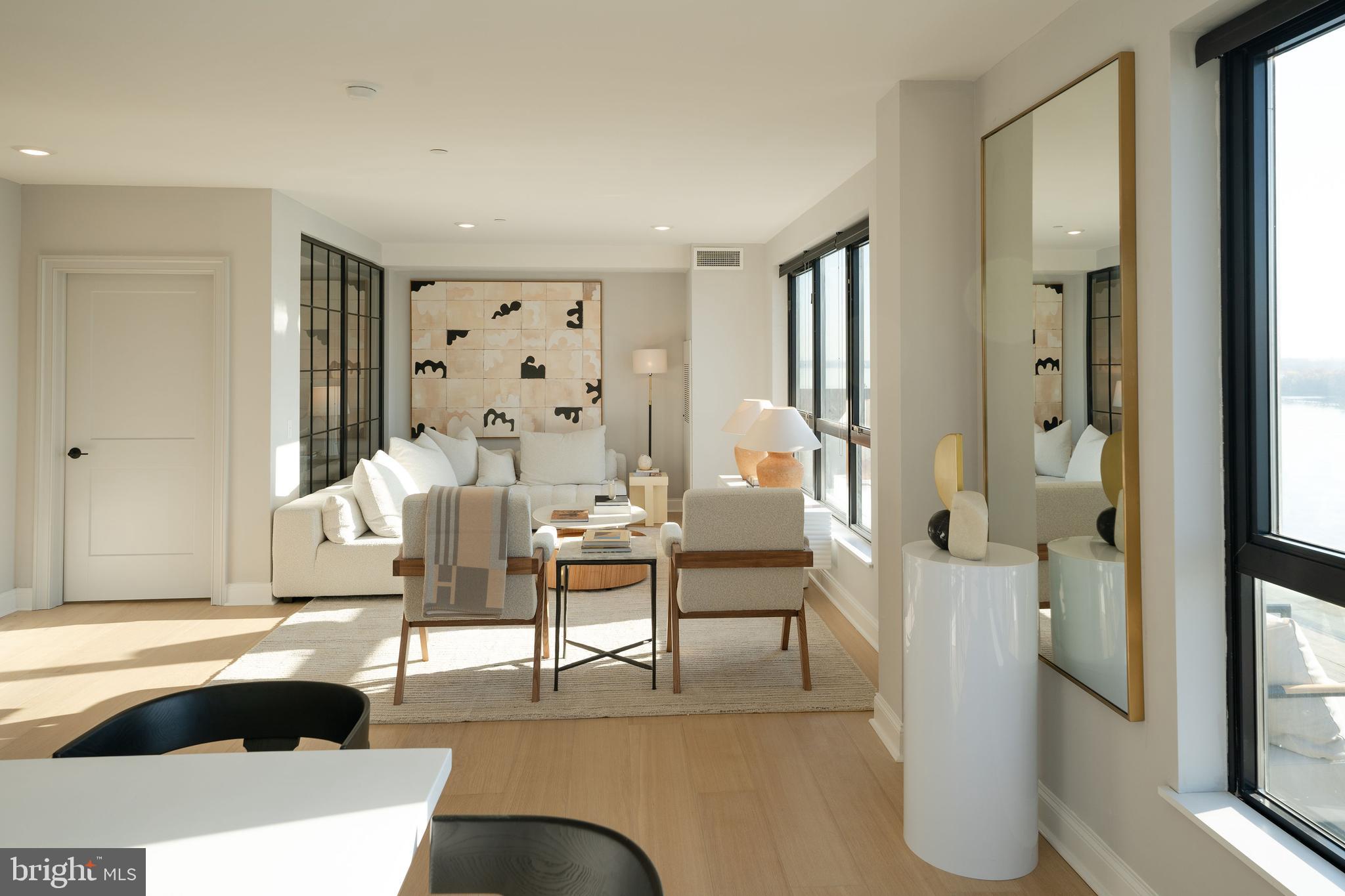 CURRENTLY OFFERING 2 months FREE on a 14-month lease. Unmatched Urban Luxury with Iconic Views & Industrial Elegance- Welcome to an unparalleled living experience in this spectacular 2-bedroom, 2-bath luxury apartment spanning 1,196 square feet of meticulously crafted interiors. Offering panoramic views of the Delaware River, Ben Franklin Bridge, and Center City, this residence harmonizes industrial charm with contemporary opulence, creating a sanctuary of style and sophistication.
Bathed in natural light from oversized factory-style windows, the living and dining spaces boast 8” wide plank oak floors, offering a warm yet modern foundation. The chef-inspired kitchen is a masterpiece of design, featuring quartz countertops with a seamless full-height backsplash, custom two-toned oak and soft-close cabinetry with integrated pulls, and top-of-the-line stainless steel appliances. Every detail speaks to refined craftsmanship, from the matte black faucet with pull-down sprayer to the modern roller shades that perfectly complement the sleek, industrial aesthetic.
Retreat to the spacious bedrooms, designed with both relaxation and function in mind. With generous closet space and an open layout, these rooms offer serene escapes from the city bustle. The primary suite boasts a spa-quality bathroom, complete with a walk-in glass shower, floor-to-ceiling subway tiles, and a custom oak vanity. Herringbone ceramic floors, bespoke mid-century sconces, and Kohler bath fixtures elevate the experience, blending timeless elegance with modern convenience.
This residence goes beyond beauty, integrating cutting-edge technology for ultimate convenience. Keyless entry, smart thermostats, and a connected campus with seamless Wi-Fi from the lobby to the rooftop make every aspect of living effortless.
Living here means access to a suite of exclusive amenities designed to enhance every aspect of your lifestyle. The rooftop offers four interconnected experiences, allowing you to soak in the vistas of the Delaware River and Philadelphia skyline. Whether you're working out in the state-of-the-art fitness center—complete with basketball courts, rock climbing walls, and private studio space—or unwinding at Pier 61, a riverside retreat with a concert barge, the possibilities are endless.
Explore new culinary skills in the demonstration kitchen, host unforgettable gatherings in the resident bar, or lose yourself in a favorite book at the cozy library. Dedicated workspaces with open desks and plush lounge areas allow for deep focus and productivity without ever leaving home. (Photos are of model unit and may not match this specific unit)