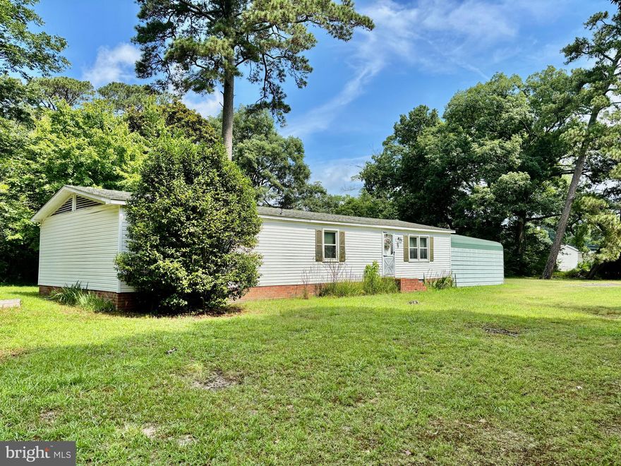 Affordable opportunity in Pocomoke! This 3-bedroom, 2-bathroom manufactured home sits on a large lot with tons of potential. With a little TLC, it could make a great addition to an investment portfolio or be transformed into a comfortable primary residence. Inside you'll find a spacious living room filled with natural light from the large triple-pane windows—great for energy efficiency and comfort. The dining area flows into a galley-style kitchen, and just down the hall is a full guest bathroom with laundry hookups. There are two large guest bedrooms and a primary suite with its own full bath and stall shower. Home is equipped with a Carrier heat pump for efficient central heating and air conditioning. Outside features include a carport, shed, and patio—plus plenty of yard space to make it your own. Being sold as-is. Schedule your showing today!