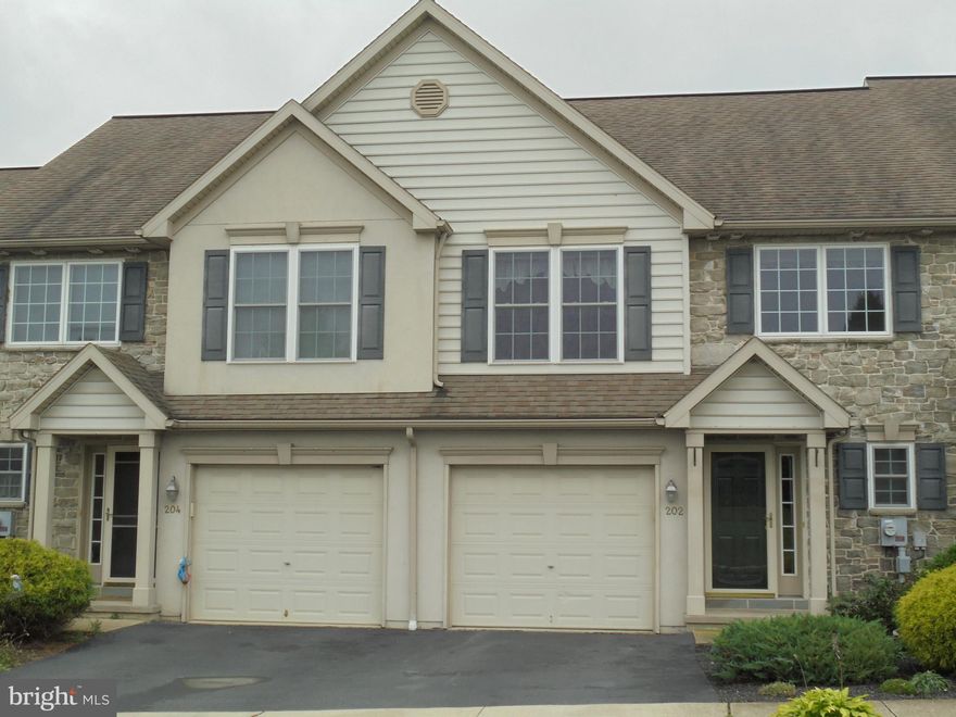 Attractive Townhome with First Floor Living! The wonderful features include: 1st floor primary suite w/walk-in closet, double vanity and large stall shower. Open great room w/lofted ceiling, gas fireplace & sliders to deck.  Dining room has attractive knee wall w/column. Kitchen has built-in microwave, dishwasher, extended counter for bar stools, double sink & recessed lighting. Powder room w/pedestal sink. First floor laundry room w/cabinets. Upstairs offers spacious loft, two additional bedrooms, main bath and walk-in attic for storage. Additional features of this property include: Nice back yard w/deck (has retractable awning), large basement, gas heat and 1 car garage.