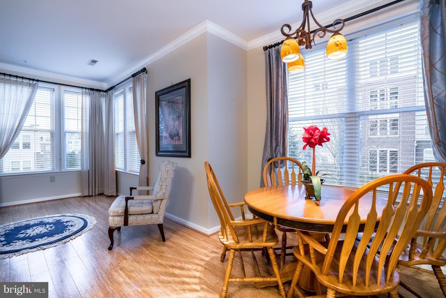 Wow..this one is beautiful!! Large 3rd floor condo with open concept-- 1310 SQ. Feet-CORNER UNIT WITH TONS OF NATURAL SUNLIGHT - this kitchen is larger than most homes. bamboo floors- white corian tops- eat in kitchen with family room nook off of kitchen. screened balcony- full sized washer/dryer- $140/year water fee-ENJOY THE POOL-FITNESS AREA-COMMUNITY CENTER-TENNIS COURTS- SHOW AND SELL TODAY!