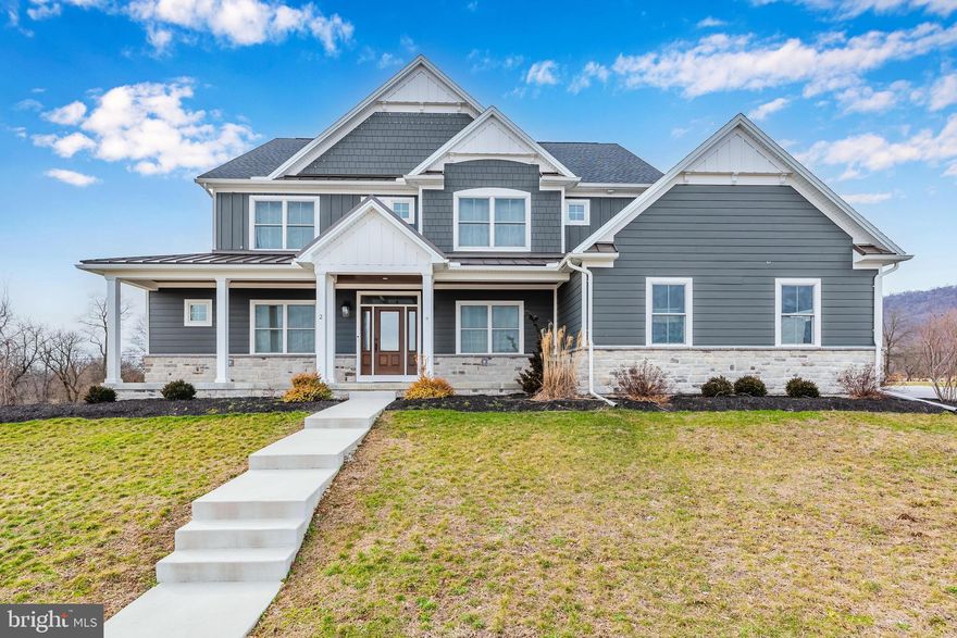 Welcome to 2 Blue Marlin Way, a masterpiece of modern luxury nestled in the heart of the prestigious Glendale Estates. This immaculate, newly constructed 5-bedroom, 5.5-bathroom home, located in the coveted Cumberland Valley school district, is a true embodiment of elegance and comfort.

As you approach the home you'll be greeted by lush open greenery and breathtaking mountain views, setting the tone for the serenity that awaits within. Situated on over 1 acre, this residence boasts meticulous attention to detail and top-notch craftsmanship throughout.

Step inside, and you'll be captivated by the seamless flow of the open floor plan, adorned with earth-toned hardwood flooring on the main level and 2nd-floor hallway. The gourmet kitchen, a culinary enthusiast's dream, features quartz countertops, a butler's pantry for additional storage and prep space, and an expansive 8x10 pantry.

The main level offers versatility with an office or 5th bedroom, complete with its own walk-in closet and full bath – a perfect retreat for guests or a dedicated workspace. The thoughtful design extends to the mudroom and a 3-car side entry garage, providing convenience and ample storage.

Upstairs, each generously sized bedroom boasts its own access to bathrooms, ensuring comfort and privacy for all occupants. The Primary suite is a sanctuary of luxury, featuring a 5' tiled shower, a floating tub, and a walk-in  California Closet, providing a stylish and organized haven.

If you need even more space the basement is fully finished with open rooms for the kids to spread out, play games or just relax.  There is also an enclosed bonus room for that home gym or crafting room.

This home goes beyond aesthetics, prioritizing comfort with separate heating systems on each floor, allowing for personalized and even warmth throughout. Whether you're entertaining or enjoying quiet family moments, the layout ensures a harmonious blend of functionality and beauty.

Experience the pinnacle of modern living at 2 Blue Marlin Way – where luxury, craftsmanship, and tranquility converge to create an unparalleled home in the coveted Glendale Estates.