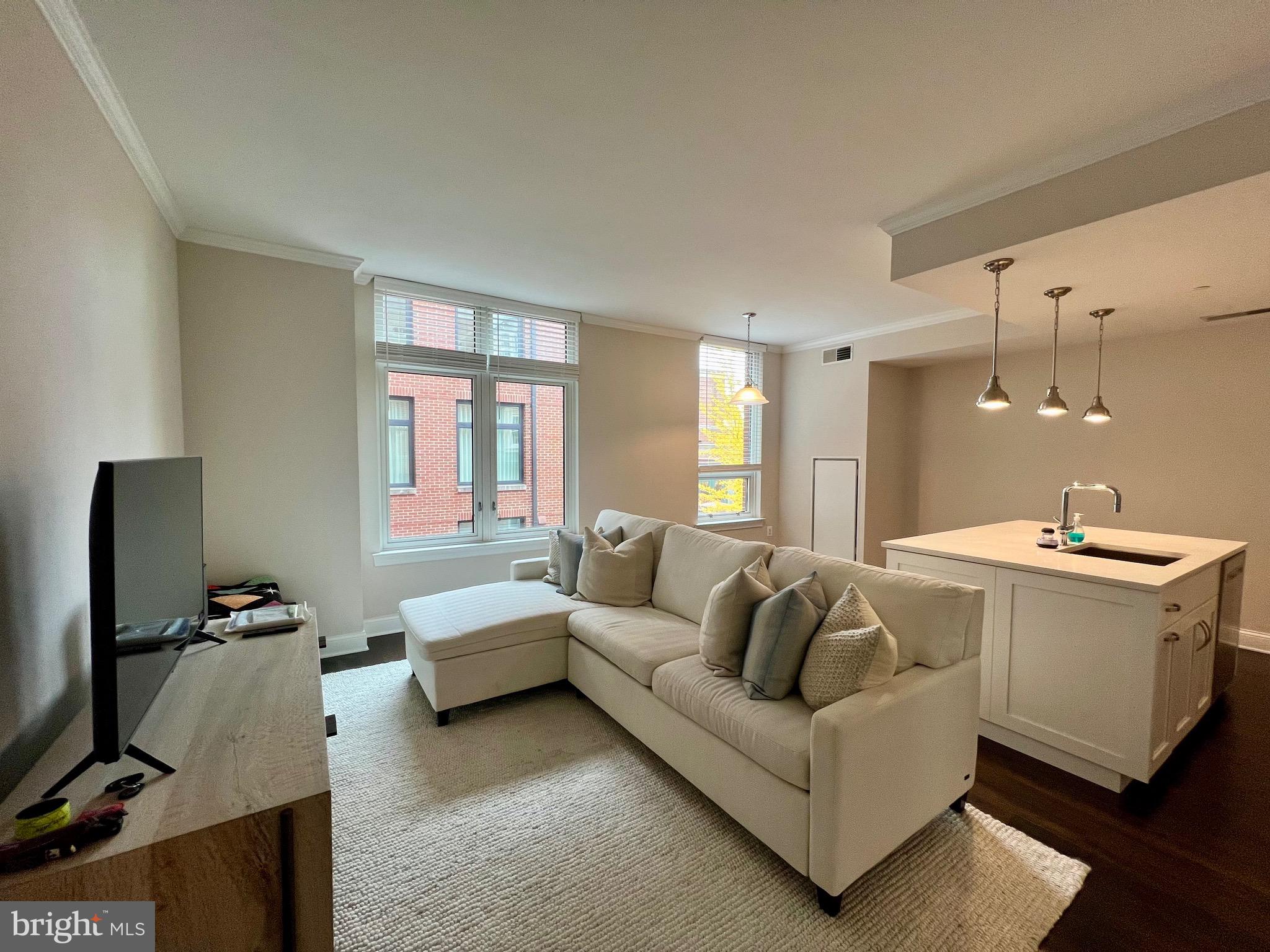 Welcome home to Hampden Row! Tucked away, yet in the heart of Bethesda, delight in being a block from the hustle and bustle of Bethesda Row and a 6 minute walk to Bethesda Metro Station. The 1br/1ba condo features hardwood floors, top-of-the-line stainless steel appliances, quartz countertops and an island open to the living area - perfect for entertaining! Enjoy a spacious bedroom with ample closet space as well as a large bathroom featuring double vanity and rain shower. Washer/Dryer IN UNIT!  One assigned garage parking space, 24/7 Concierge Desk, fitness center, lounge and two rooftop terraces with BBQ grills and fire pit overlooking Bethesda. Don't miss out on a chance to call this urban gem home!