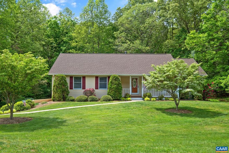 Pristine and picture-perfect 3 bedroom/3 bath Deer Lake Estates home that's move-in ready.  Light-filled and welcoming offering hardwood floors, a vaulted ceiling in the large living area with access to the back deck.  The incredibly spacious kitchen is finished with Quartz counters, modern floating shelves and plenty of cabinets as well as a pantry.  The primary bedroom offers a lovely remodeled bath with walk-in tiled shower and dual vanities.  Improvements include a new roof in 2024 and hot water heater in 2021.  Downstairs you'll find a fully finished rec room, another full bath as well as unexpected storage areas.  The oversized 2 car garage has workshop space as well as additional storage.   The gorgeous backyard is framed with woods yet offers sunny and flat areas for play and gardening.   Cul-de-sac location and 5 minutes to shopping/conveniences.  12 minutes to NGIC/DIA and UVA Research Park,Quartz Counter,Wood Cabinets,Fireplace in Living Room