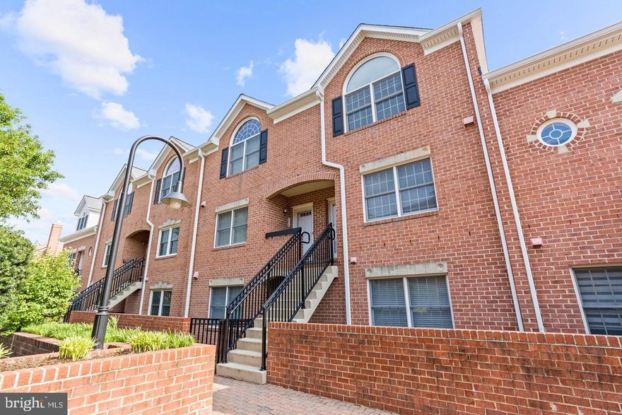 Welcome to this extremely rare 2 level 2 bedroom, 2.5 bath townhouse style condominium with over 1250 square feet in the highly desirable Falls Station Condominiums. This unit is set one story above the parking lot level. At the unit's entrance is a foyer with marble tile and a coat closet. The main level of the unit has an open floor plan with an open kitchen, dining, and living area combination, The spacious kitchen is at the front of the unit with a large window, ample counter, cabinet, and pantry space, tile floor, and gas cooking. This level features a powder room, gas fireplace, and a large sliding glass door to a huge covered balcony with treetop views! The top level features a laundry closet at the top of the stairs. There are 2 large bedrooms with cathedral-style ceilings, large windows, and closets. There is a very nice-sized bathroom that serves the bedroom at the front of the house. This bathroom has an enormous vanity with lots of storage and counter space, and a separate shower and jacuzzi tub. The second bedroom at the rear of the home also has a full bathroom. The unit has both a newer HVAC & a hot water tank. Newer carpet throughout the unit. There is one reserved covered parking space assigned to this unit and one guest parking pass for the visitor spaces. Conveniently located just off I-66, this location is an ideal commuter, amenity-rich location. Walking distance to parks/W&OD trail, East Falls Church Metro Station is approximately 1/2 mile via W&OD bridge with accessibility to both silver and orange lines, the best of both Arlington & Falls Church City worlds!