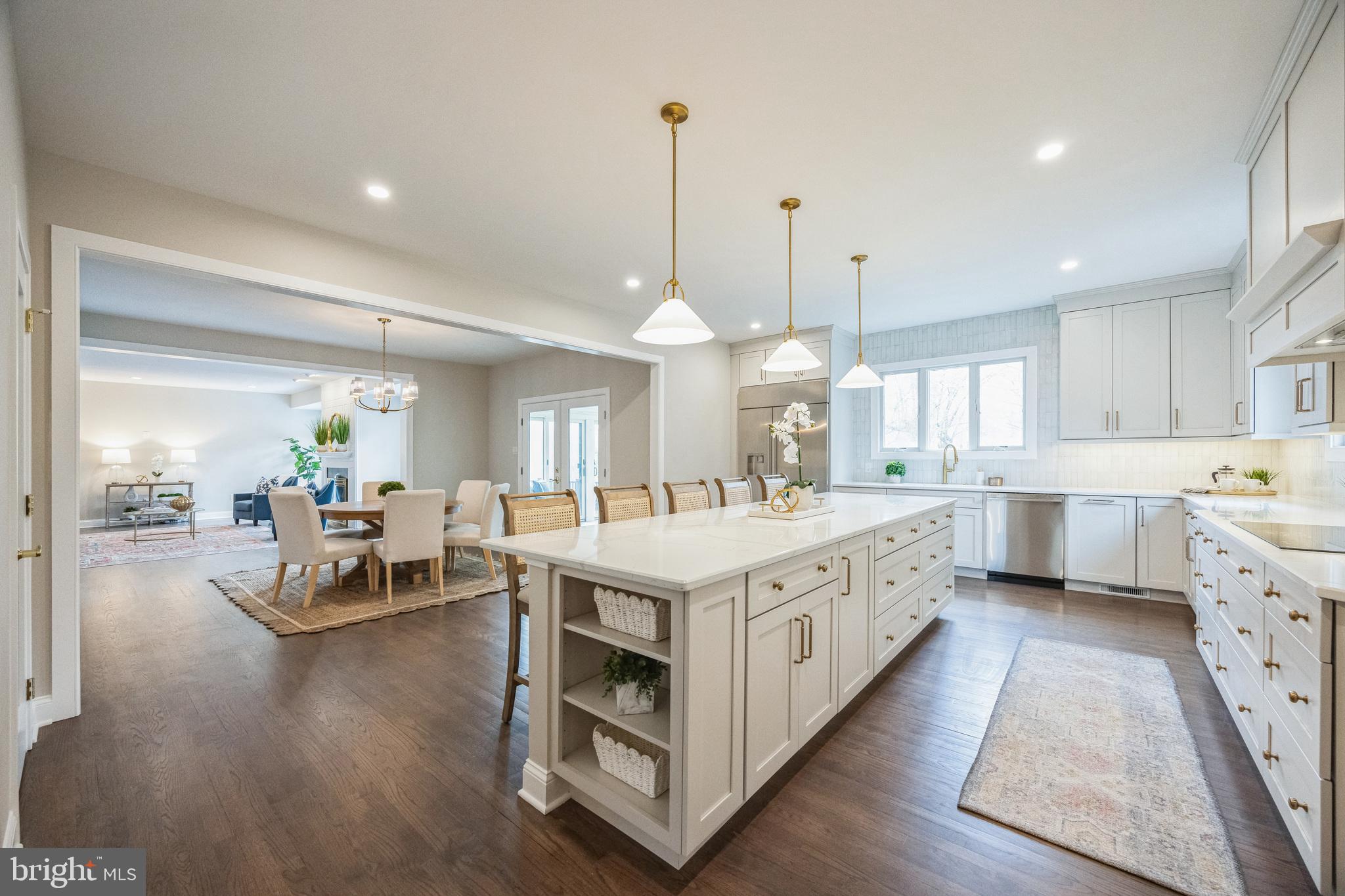 Welcome home to 202 Barn Hill Road! Located in the prestigious Blue Rock Meadows community, this exquisitely updated, custom-built cape home seamlessly blends elegance with comfort. Situated on an elevated lot with breathtaking views, this residence underwent a comprehensive remodel in 2024/25, incorporating over $500,000 in enhancements. Notable features include a spacious custom kitchen, an impressive first-floor primary suite, a 50 yr shake roof installed in 2012, and open-plan living areas overlooking the in-ground heated pool on nearly 2 acres.
Upon arrival, the driveway guides you to a picturesque stone and clapboard façade, complemented by a generous side-entry three-car garage. Entering through the front door reveals a welcoming foyer with hardwood floors extending throughout the main level. To the left, French doors lead to a sizable home office equipped with built-ins, while the formal dining room, ideal for gatherings, connects to an elegant butler's pantry with wet bar featuring a beverage fridge. The rear of the home boasts a bright, open living area with a gas fireplace and two sets of double doors that lead to the deck. Adjacent to the breakfast room is a sunroom with skylights and expansive glass. The gourmet kitchen is a culinary enthusiast’s dream, complete with built-in appliances, custom cabinetry, and substantial quartz island. A walk-in pantry provides ample storage, accompanied by a mudroom, laundry room, half bath, and a versatile bonus room. The main level primary suite offers views of the pool and includes a walk-in closet and a luxurious bath.
Upstairs, there is a second suite and four additional bedrooms with connected baths. The finished walk-out basement with exercise area, rec room and convenient half bath leads directly to the pool area, completing this exceptional home. Conveniently situated near downtown West Chester, residents benefit from easy access to schools, dining, shopping, and recreational activities. Offering both privacy and proximity, this home is the perfect sanctuary to call home.