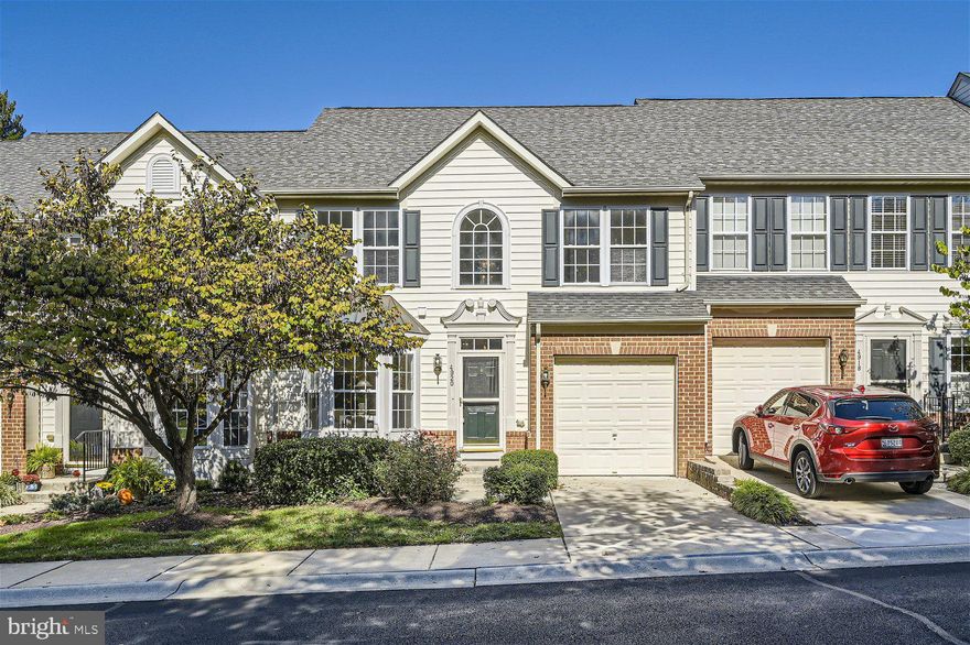 Newly refreshed 3BR/2.5BA Townhome located in the desirable 55+ community of Ellicott Mills.  Notice the beautifully maintained lawns and landscaping as your park in your private driveway and make your way to the entrance of your forever home. Step into an entry hall that beams natural light from the vaulted ceiling and transom windows above the doorway.  Your eyes are drawn toward the wood railing leading to the second floor, but also to the hardwood flooring down the hall and into the main living space. A large breakfast room with a bowed window space leads into the walk-through kitchen with a view of the stunning brick fireplace feature. In the kitchen are tons of cabinets, a separate pantry closet, stainless steel appliances, beautiful quartz countertops, tiled backsplash, and a large stainless sink under a pass through into the dining room.  An open concept dining and living rooms make for the ideal space to host gatherings.  The stacked stone gas fireplace adds tons of charm to this already amazing space. Not only is there access to the one-car garage, there's a half bath and an oversized main floor owners suite. New carpeting in the owners bedroom featuring a walk-in closet and an updated ensuite with a double sink vanity and a deep tub/shower.  On the second floor is an open loft space with gorgeous views of the fireplace and mail living area, two primary sized bedrooms and a full bath. The lower level is finished offering additional living space with room for everyone in the family, storage, and laundry. There is plenty of green space just outside with a forest-like background, an amazing space for hosting family and friends.  This home is move-in ready with so much to offer any new homeowner including a freshly painted interior and new carpeting.  Imagine all this and in close proximity to shopping, restaurants, and commuter routes