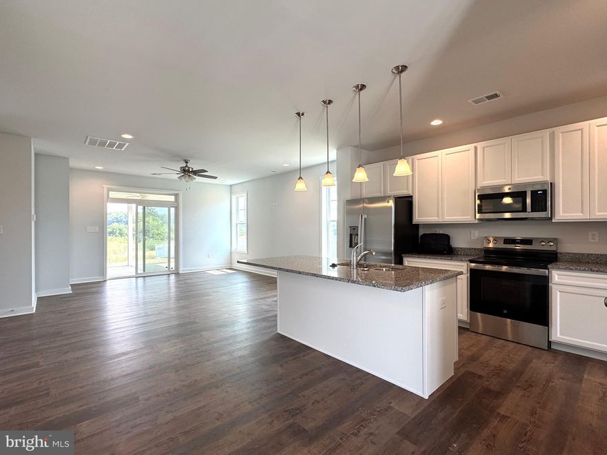 Ready for Immediate Delivery! Step into this beautifully designed 5-bedroom, 3-bath rancher offering over 2,100 sq ft of comfortable, stylish living. The main level welcomes you with an open-concept layout that flows effortlessly from the kitchen to the family and dining areas—perfect for entertaining or cozy family nights. The kitchen features a spacious island, granite countertops, pantry, and stainless steel appliances, making meal prep a joy.

The primary suite is a private retreat, complete with tray ceilings, a large walk-in closet, and a luxurious bathroom with a tile shower. Both the family room and the primary bedroom open onto a 15x14 screened-in porch, creating a seamless indoor-outdoor space for relaxing mornings or evening gatherings. Three bedrooms on the main level provide space for family or guests, while upstairs offers two additional bedrooms, a third bath, and a finished loft ideal for a home office, playroom, or media space.

Outside, charming stone accents and shake siding create instant curb appeal, while a concrete driveway leads to a 2-car garage with automatic opener. The home combines style and function, offering a space that’s perfect for entertaining, relaxing, and making memories. 
Ideally located just minutes from I-81, shopping, grocery stores, and restaurants, and near both Spring Mills and Hedgesville, The Communities of Burwell offers the perfect blend of modern comfort and everyday convenience. Built smarter, finished better!

Builder is offering $20,000 in closing cost assistance w use of preferred lenders.