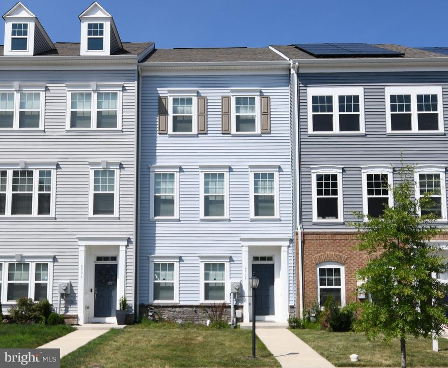 Welcome to this beautifully maintained and thoughtfully upgraded 4-year-young townhome in the highly desirable Tallyn Ridge community—just steps from the award-winning Oakdale school district. The entry level features a spacious open foyer and a flexible bonus space—perfect for a home office, gym, or guest room—with potential to convert into a fourth bedroom. This level also includes a convenient half bath and access to a fully upgraded two-car garage. Upstairs, the main living level offers an expansive open-concept layout enhanced by elegant crown molding, recessed lighting, and direct access to a large private deck—ideal for entertaining or everyday relaxation. The gourmet kitchen is the centerpiece of the home, featuring quartz countertops, stainless steel appliances, and a spacious center island with bar seating. On the upper level, you’ll find three well-appointed bedrooms, including a luxurious primary suite with a walk-in closet and a spa-inspired en-suite bath boasting a tiled shower with dual shower heads and a double-sink vanity. Two additional bedrooms are thoughtfully positioned away from the primary suite and share a stylish hallway full bath, offering privacy and comfort—perfect for guests, family members, or roommates. This move-in-ready home offers the perfect blend of modern design, functionality, and location, set in one of Frederick’s most desirable communities with easy access to parks, trails, commuter routes, and more.