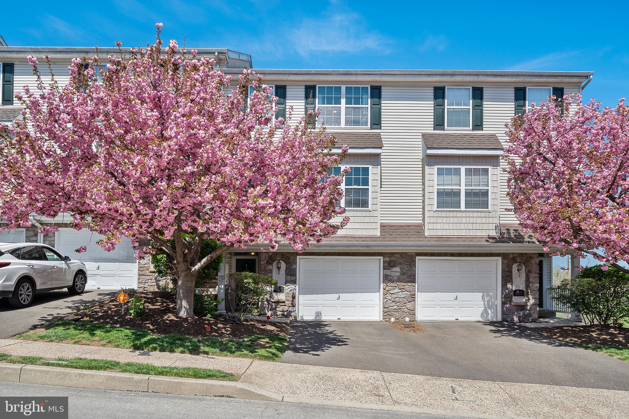 Available June 1st – Beautifully Updated Townhome in Sought-After Garrison Greene. Welcome home to this stunning, move-in ready townhome in the desirable Garrison Greene community. This beautifully updated residence offers an ideal combination of comfort, style, and convenience. Step into a newly remodeled kitchen featuring stainless steel appliances, quartz countertops, new wood floors, and a spacious island with bar seating—perfect for cooking and entertaining. The open-concept layout flows effortlessly into the dining area and spacious living room, where soaring two-story windows fill the space with natural light. Upstairs, you'll find two generously sized bedrooms, each with its own en suite bathroom and large walk-in closet. The laundry area is conveniently located on the bedroom level for added ease. Enjoy outdoor living on the large, newly refinished deck off the living room—an ideal space for relaxing or dining al fresco. The lower-level family room offers even more living space and features a cozy gas fireplace for year-round comfort. Additional amenities include an attached one-car garage, driveway parking, and access to top-rated schools. Commuters will love the easy access to Fort Washington train station, Route 309, and the PA Turnpike.
