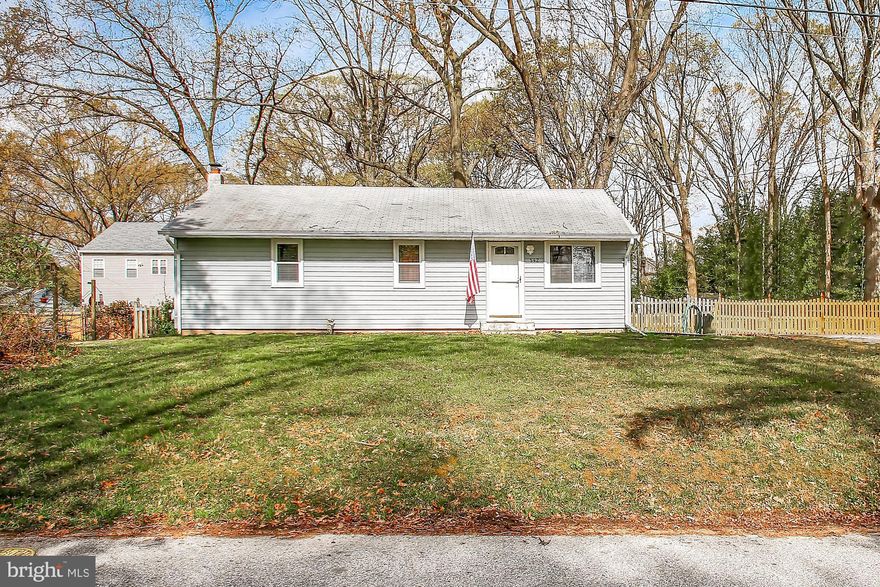 NEW PRICE $320,000!  Located in the highly sought after Severna Park School District.  Home is situated close to Benfield Road with a buffer of trees, sitting up on a small hill and back off the street, the 2nd lot in on Arundel Drive, which is a great location for walking to schools, religious facilities, grocery store, shops, restaurants!   One of the largest lots in Carrollton Manor has plenty of room for an addition or garage if desired.  Long time owner raised her children here and enjoyed many years in the completely fenced back yard.  This great home features 3 bedrooms, 2 full bathrooms, refinished hardwood floors on the main level, brand new finished family room in the basement, brand new gorgeous full bathroom in basement, newly remodeled main level full bathroom,  brand new tile floor in kitchen, new stove, new refrigerator, new dryer, 6 ceiling fans throughout, new HVAC, rear deck off of kitchen for cookouts, corner lot, Home Warranty, the list goes on!  The finished lower level could make for a great in law suite.  Basement has been professionally waterproofed.  All appliances convey.  Community offers beaches and boat ramp for a voluntary fee.  Rare .30 acre lot in Carrollton Manor.  Convenient commuter location to DC/Annapolis/BWI.  Be sure to check out http://carrolltonmanor.us to learn more about the community.