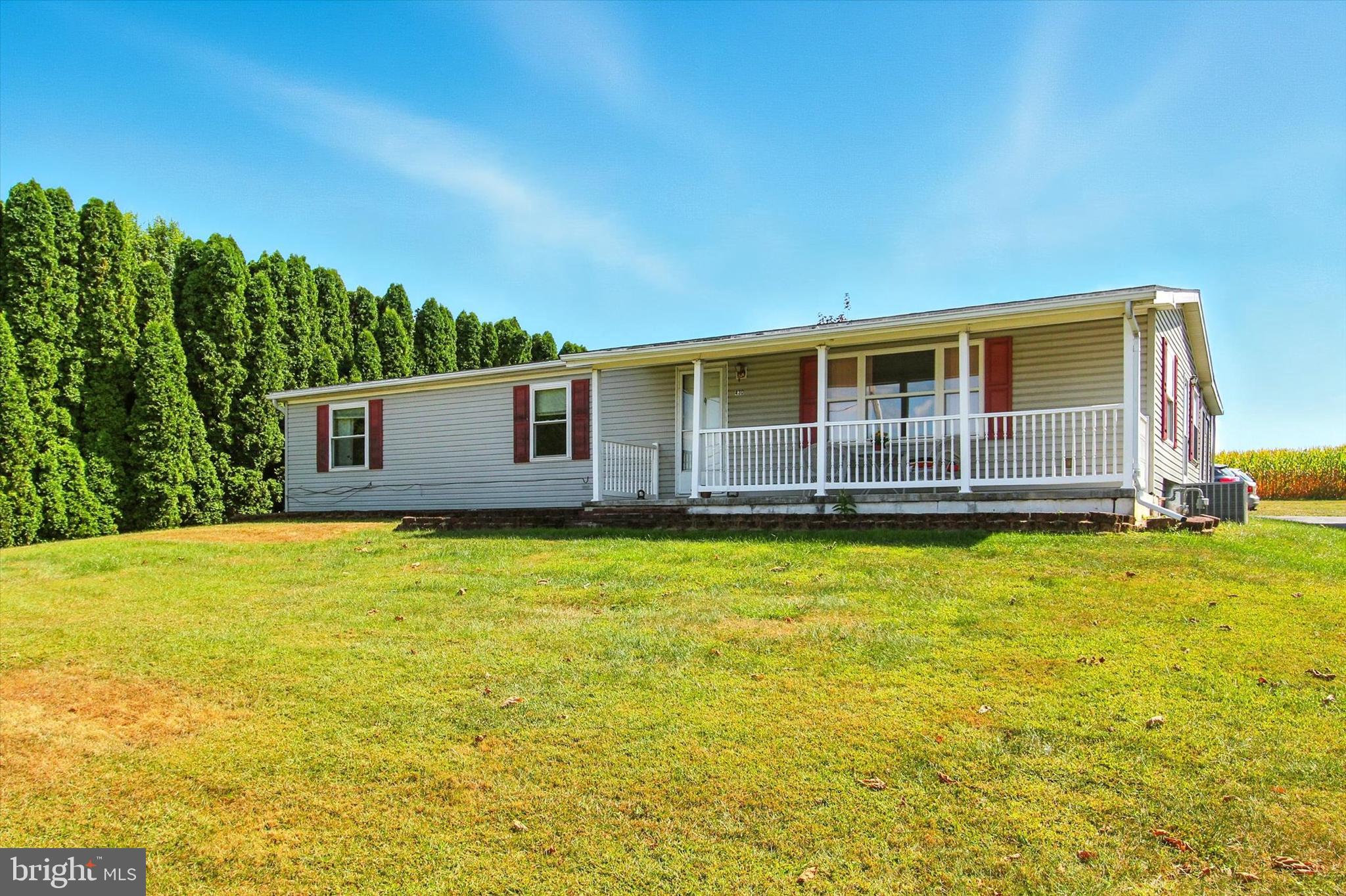 You will be amazed by the curb appeal, condition and updates on this mobile home on a foundation. A spacious 3BR 2 Full; Baths in a low maintenance home. It boasts newer roof, new hot water heater, newer air conditioning, and more. The yard has a really nice hedge row on its left side, a partial fenced in area for puppies and backs up to farmland that's protected. It is centrally located with easy access to shopping, dining, schools and more. Easy access to Maryland and other surrounding areas. You will be surprised how at home you feel. Can't say enough, it is a must see.