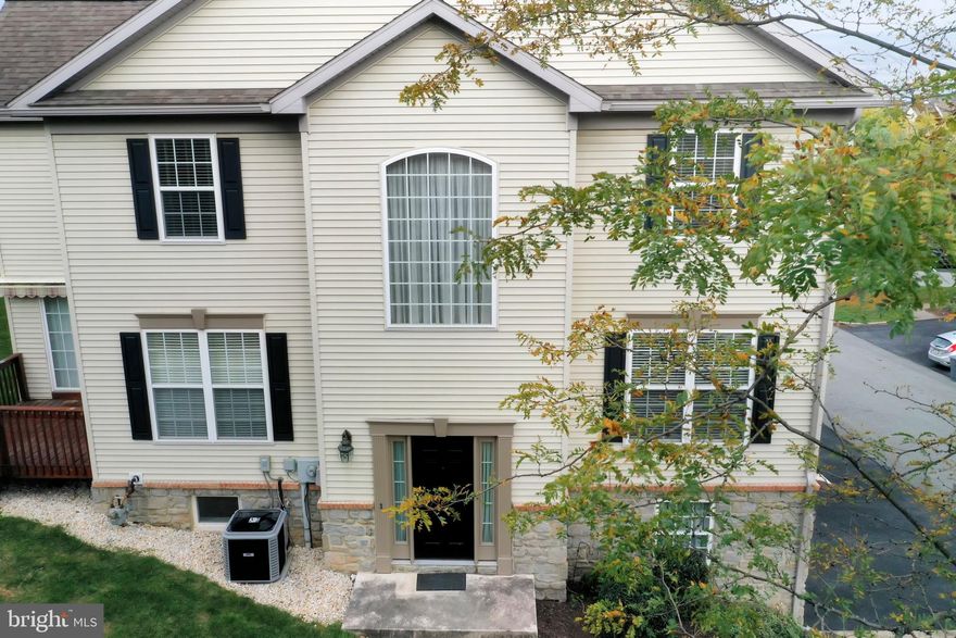 Beautiful Home in Dallastown Schools! This move in ready, end unit, with expanded floor plan and sunroom addition. Features fresh paint and new carpet throughout. Deluxe owners suite with whirlpool tub and 2 walk-in closets. Wonderful sunroom that leads out to the 10x10 deck with awning.  Spacious open kitchen with island and ceramic backsplash. Finished lower level with family room/Den with gas fireplace and half bath.  Over sized two car garage for extra space for storage.  All of this in a great location!