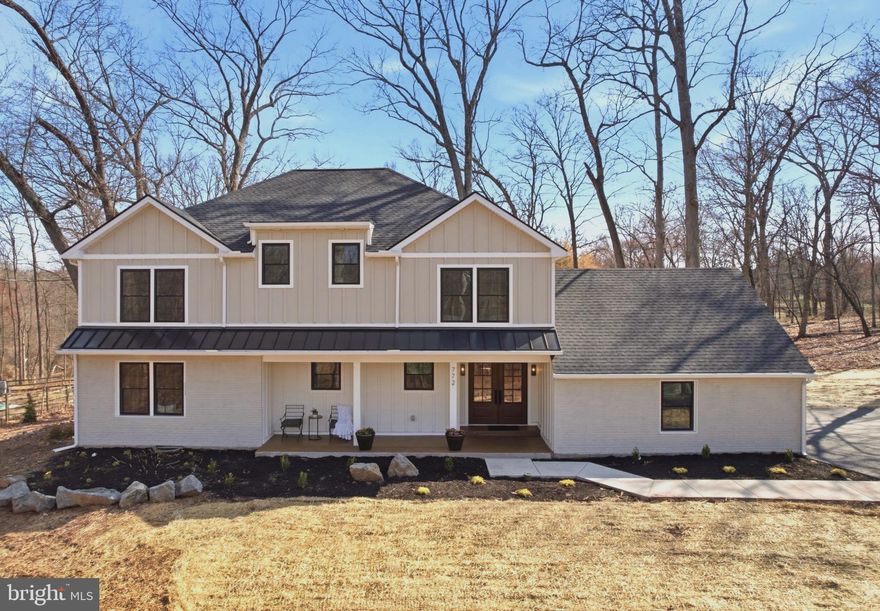 Move-In Ready Luxury with the Feel of New Construction—Without the Wait! Privately tucked at the end of a quiet cul-de-sac-style lane in the Hidden Forest setting of Skippack Township, this home sits on a rare 1.68-acre flat, park-like lot—offering an extraordinary blend of privacy, space, and refined living.

UPGRADES & ADDITIONS:Extensively upgraded and thoughtfully expanded and reimagined for modern living. Major improvements include a  second-floor addition, a fully rebuilt and redesigned main level, and a finished basement with walk-out access for added versatility. The home features all-new systems, including a high-efficiency daul Carrier HVAC systems, along with new double hang windows, new single-panel interior doors, a new roof, custom trim work on doors and windows and premium James Hardie siding for lasting durability and curb appeal.  Newly built FRONT AND BACK porch with METAL roof, tongue& groove ceiling with recessed lights. Every detail reflects quality craftsmanship and elevated design—offering a true “better than new construction” experience without the burden of HOA restrictions or additional new construction taxes.


INTERIOR: Inside, luxury finishes define every space. SOLID hardwood flooring runs throughout, complemented by custom millwork and recessed lighting. A grand double-door foyer opens to thoughtfully designed living areas, including both a formal living room and a spacious family room featuring custom RH-inspired built-ins and a wood-burning fireplace.

The main level has been carefully designed to offer the best of OPEN-CONCEPT living while still creating a sense of separation and privacy. Smartly integrated storage solutions—including a custom walk-in closet—provide flexible space to keep everyday living organized.

The GOURMET kitchen is a true showpiece, centered around a dramatic waterfall-edge quartz island and outfitted with premium cabinetry, pantry storage, stainless steel appliances, and a 6-burner GAS range.  A seamless quartz backsplash and custom hood create a timeless, high-end look, while the commercial-grade exterior-vented exhaust delivers top-tier performance. Built-in microwave and wine/baverage cooler, garage disposal. 

The MAIN level also features a private BEDROOM suite complete with a full bathroom and walk-in closet—ideal for office, guests, extended family, or multigenerational living—along with an additional well-appointed powder room for everyday convenience. A dedicated laundry room enhances functionality with built-in shelving, cabinetry, and a utility sink.

UPSTAIRS, the expansive primary suite—enhanced by the addition—features cathedral ceilings, a sitting area, peaceful wooded views, and a spa-inspired bath with slate flooring, a quartz vanity, and a multi-head walk-in shower. Three additional bedrooms offer hardwood flooring, ceiling fans, and generous  built-in closet space, while a beautifully finished hall bath includes a double vanity and designer tilework.

The partially finished BASEMENT adds valuable flexibility, with both interior access and walk-out exterior steps. Ideal for a playroom, home gym, media room, or mancave, the space also includes built-in shelving for practical storage.

Ideally located just minutes from Skippack Village, this home offers easy access to boutique shopping, dining, and year-round community events. Outdoor enthusiasts will enjoy nearby Evansburg State Park with miles of scenic trails, while Main Street at Collegeville provides additional shopping, dining, and fitness options. With convenient access to the Pennsylvania Turnpike, commuting to King of Prussia, Philadelphia, and beyond is effortless—all within the highly desirable Perkiomen Valley School District.