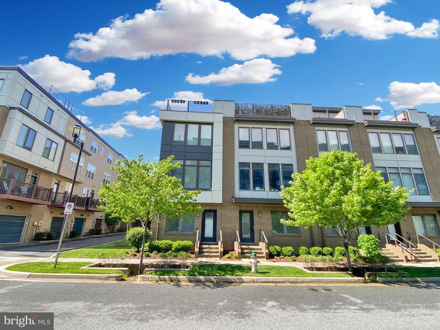 Welcome to this stunning 4-level end-unit townhome in the highly desirable Westside at Shady Grove Metro community! This beautiful ​EYA Gershwin Model is flooded with natural light, thanks to the extra windows exclusive to end units. The entry level features a welcoming foyer, a spacious ​h​ome office, and convenient access to the attached 2-car garage.​ Hardwood floors flow throughout the home, leading you to a wide-open main level designed for both everyday living and effortless entertaining. The living room, dining room, and modern kitchen connect seamlessly, creating an inviting and airy space for gatherings. ​Private balcony just off the kitchen​ with a gas grill connected to the gas line.​ Upstairs, the large primary suite offers a peaceful retreat with a walk-in closet and a full ensuite bathroom. Two additional generously sized bedrooms, a full hallway bathroom, and convenient bedroom-level laundry complete this floor. The top level is a true highlight, featuring a spacious loft with a walkout to a private rooftop terrace — the perfect spot to relax and take in the beautiful views.​ Beyond the home itself, the vibrant Westside community offers a rich array of amenities, including a clubhouse with a party room and gym, a playground, outdoor dining areas with grills, open green spaces, a cozy fire pit, a cornhole court, a dog park, and a sparkling swimming pool. Shops and restaurants like CVS and Starbucks are just steps away, making everyday living a breeze.​ With Shady Grove Metro within walking distance and easy access to I-270 and the ICC, commuting couldn't be more convenient.​ Don’t miss your chance to live in this bright​ & spacious​ home in this well connected community — schedule your private tour today!​ Furniture can convey.