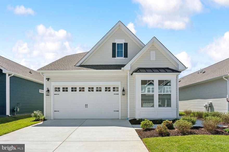 The Simone is a beautifully designed home with a projected settlement of May 2026, offering the space and features you are looking for. With 4 bedrooms, 3 full baths, and a 2-car garage, this home balances everyday comfort with thoughtful design details.

A dedicated home office provides the perfect space for remote work or study, while the great room is anchored by a striking two-story shiplap fireplace with a granite surround, creating a warm and inviting focal point.

The kitchen is well-appointed with a gas cooktop, single oven, microwave, range hood, dishwasher, French-door refrigerator, and pendant lighting, complemented by a tile backsplash and quartz countertops that continue into the owner’s bath.

LVP flooring flows through the foyer, kitchen, dining area, great room, owner’s suite, and bedroom two, while tile finishes the full baths and laundry room. Plush carpeted spaces in the loft, second floor, and additional bedrooms add comfort where it counts. The owner’s bath features a spa-like shower with seating, a handheld wand, and double sinks for added convenience.

For a full list of features for this home, please contact our sales representatives.
Photos are for illustrative purposes only and may not represent the exact home or finishes available.

Welcome to a new luxury active adult 55+ community on Maryland's Chesapeake Bay. Discover the amenity-filled, resort-style experience within 45 miles of Washington DC and Baltimore. Residents can take advantage of the community's 24,000 sq. ft. clubhouse with indoor & outdoor pools, a state-of-the-art fitness center, and multiple tennis and pickleball courts. With a full-time lifestyle director on site the community also features a well-maintained calendar of activities such as walking club, indoor and outdoor yoga sessions, mahjong club, kayaking, pickleball and more. Kent Island life is about making friends and enjoying the company of people who have worked hard and now want to enjoy all that a luxury 55+ community has to offer. Located steps from the water and minutes from Annapolis, the location also offers quick access to Rt. 50. Enjoy the convenience of nearby dining and shopping options together with the quaint charm of a small town.