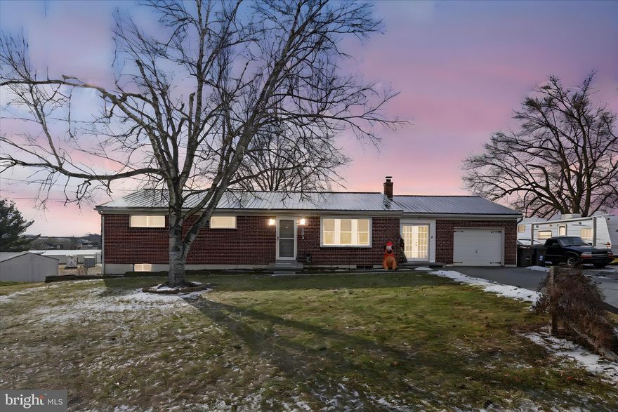 Coming Soon!!  Charming 3-bedroom, 2-bath home in a peaceful country town setting. This property features a brand-new metal roof, 1-car attached garage, and a fully fenced yard. Enjoy outdoor living on the covered deck, perfect for relaxing or entertaining. Inside, you’ll find custom finishes throughout, including a built-in coffee bar, rough-cut floating wood shelves, and custom barn doors in the primary bedroom. The lower level offers additional living and entertaining space with a built-in bar. Conveniently located with a quiet, rural feel—this home offers comfort, character, and functionality. Move-in ready and a must-see.