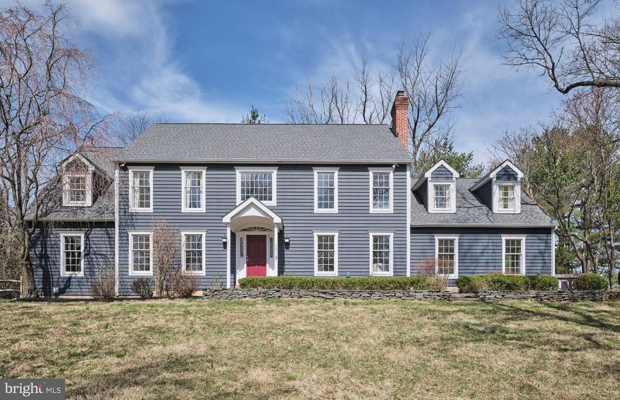 This charming 4-bedroom, 2.5-bath center hall colonial is nestled on a picturesque, tree-lined lane shared by just four homes. Situated on a private .75-acre lot, this home is thoughtfully designed to offer peace and privacy, tucked away from neighbors and road noise.

Significant recent upgrades and improvements include a NEW ROOF, a certified septic system with a new distribution box, and many new windows on the rear of the home, enhancing both functionality and natural light. Both rear sliding doors to the backyard have also been replaced, creating seamless access to the outdoor space. The wood-burning stove in the family room adds warmth and character. This home is equipped with a whole-house generator, ensuring peace of mind. Outside, the backyard is equipped with sprinklers for easy maintenance and a lush, green landscape. Extensive exterior repairs have also been completed over the winter.  Additionally, trees have been removed to open up the backyard, creating a brighter and more inviting outdoor space.

Upon entering, you’ll be greeted by a grand two-story foyer with a curved staircase, hardwood floors, and freshly painted walls throughout the first floor and upstairs hall. The formal dining and living rooms are located on either side of the entry, with the living room featuring stunning millwork, built-ins, and a wood-burning fireplace.
The updated kitchen boasts white shaker-style cabinetry, a large island, Sub-Zero refrigerator, double ovens, and a pantry, offering both style and functionality. The adjacent eat-in area has direct access to the backyard. A one-step-down sunken family room, with another wood-burning stove insert, provides a cozy space to relax, New sliding doors lead out to the backyard. The additional study off the family room, with its floor-to-ceiling built-in bookshelves, provides a quiet retreat.

A renovated hall half bathroom and convenient laundry room are located just off the kitchen. At the end of the hall, the oversized 3-car garage offers ample space and access to the backyard.

Upstairs, the primary bedroom suite is accessed through double doors, featuring three closets—including a walk-in, cedar, and double-hung closet. A spacious sitting room with vaulted ceilings and a private deck with new railings overlooking the yard adds an extra layer of tranquility. The luxurious en-suite bathroom includes a large soaking tub, double vanity with a makeup counter, and a walk-in shower. 

Three additional bedrooms and an updated hall bathroom complete the second floor. The partially finished basement features recessed lighting and a sheet rocked ceiling, offering additional living space, with plenty of room for storage in the unfinished area.