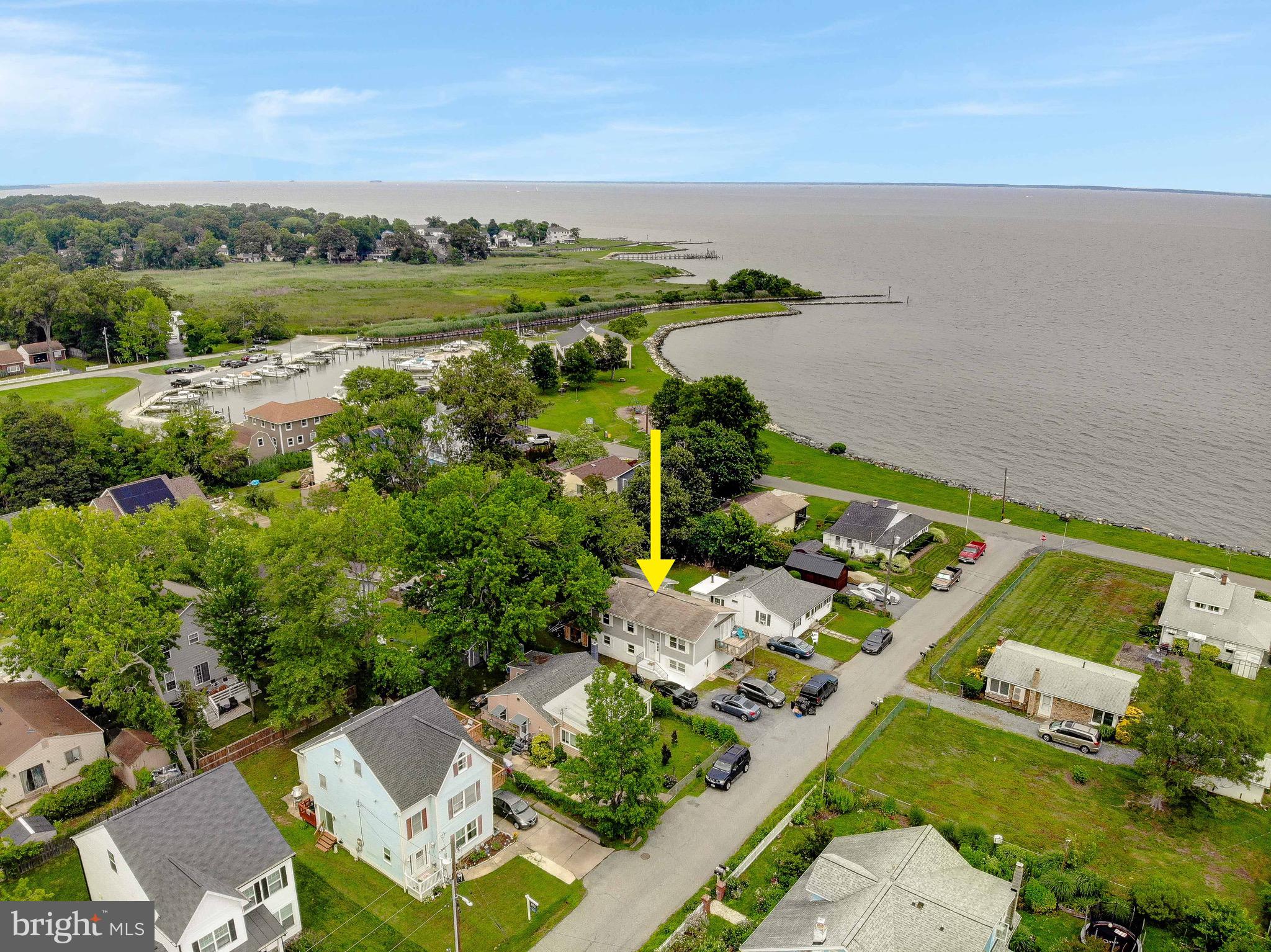 This spacious 5 bedroom, 2 full bath split foyer is located in the highly desirable Community; Cedarhurst on the Bay. This remarkable property showcases the epitome of every day, vacation living with stunning views of The Chesapeake Bay. You will quickly be captivated by the grandeur that awaits you. The open layout seamlessly connects the living, dining and kitchen area, creating an ideal environment for entertaining family and friends. The kitchen is a chef's delight including ample storage space. The primary and additional bedrooms offer comfort and privacy for the entire family. Experience outdoor living at its finest in the expansive backyard. Whether you're hosting summer cookouts or simply enjoying an evening under the stars on your deck with spectacular views; the possibilities are endless. The community beach, marina, pier, boat ramp, playground and more are just steps away!! Welomce Home to 1220 Grove Ave.