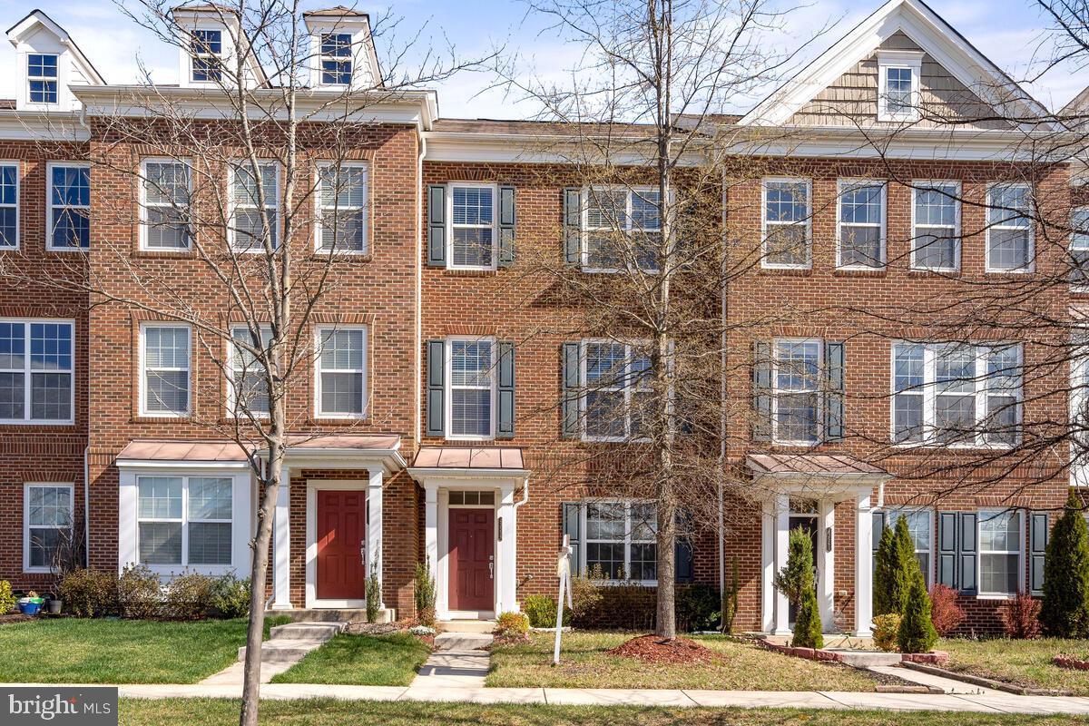 Welcome to this beautifully upgraded 4-bedroom, 3.5-bath townhome with a rear load 2-car garage in the highly desirable East Gate community of Chantilly. This move-in-ready home features fresh interior paint (2025), brand-new carpet (2025), gleaming cabinetry refinished in crisp white, and a new roof (2024), offering both comfort and peace of mind. The spacious and sun-filled main level boasts hardwood floors, 9-foot ceilings, recessed lighting, a large living area, formal dining space, and a beautifully upgraded kitchen with granite countertops, 42” cabinets, ceramic tile flooring, decorative backsplash, a central island, and stainless steel appliances (2020). A stylish powder room with pedestal sink adds convenience, while the private deck offers an ideal spot to unwind. The upper level includes a luxurious primary suite with a walk-in closet, soaking tub, separate shower, dual vanities, and updated fixtures, accompanied by two additional bedrooms, a full bath, and a laundry area. The entry-level includes a fourth bedroom or home office, a full bath, and direct access to the 2-car garage with extra storage. Enjoy the ease of smart home living with a Nest thermostat, Ring doorbell and home security system, keyless entry, and smart garage control. Ideally located within walking distance to East Gate Park & Ride, and just minutes from Route 50, Dulles Airport, Harris Teeter, and Dulles Landing and more. Community amenities include a clubhouse, swimming pool, playground, and event space. This modern, turnkey home blends thoughtful upgrades, flexible living, and prime location - don’t miss it!