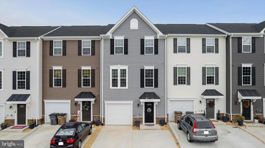 Upgrades! Upgrades! Upgrades! This beautifully designed three-level townhome offers three bedrooms, two full baths, two half baths, and a one-car garage in a convenient Culpeper location. Built recently in 2023 and thoughtfully maintained, the home sits just off Route 29, providing easy access for commuting while remaining close to the heart of down-town with its variety of dining, shopping, and local amenities.

The fully finished lower level includes a spacious recreation area, a half bath, and sliding doors that open to a fully fenced rear yard, creating flexible space for everyday living, hobbies, or relaxation. On the main level, an open and inviting layout connects the kitchen, dining area, and living room, complemented by an additional half bath. The kitchen is designed with functionality and style in mind, featuring a large island with seating, stainless steel appliances, and quartz countertops. Sliding doors lead to a private rear deck that overlooks a wooded backdrop, offering a peaceful setting for outdoor enjoyment.

The upper level is home to a generously sized primary suite with a walk-in closet and private full bath, along with two additional bedrooms that share a second full bath. A conveniently located laundry area on this level adds to the home’s practical design.

Residents of the community enjoy shared amenities that include a gazebo with grills and a walking trail, enhancing the overall lifestyle experience. The location places you approximately one mile from Main Street Culpeper, where you can explore locally owned shops and a variety of dining options. Everyday conveniences such as grocery stores, retail centers, and major shopping destinations are just a short drive away.

With easy access to Routes 15, 29, and 3, as well as nearby recreational opportunities including parks, golf, and water activities, this home offers a balance of comfort, convenience, and accessibility. An excellent opportunity to enjoy modern townhome living in a well-connected and desirable area.