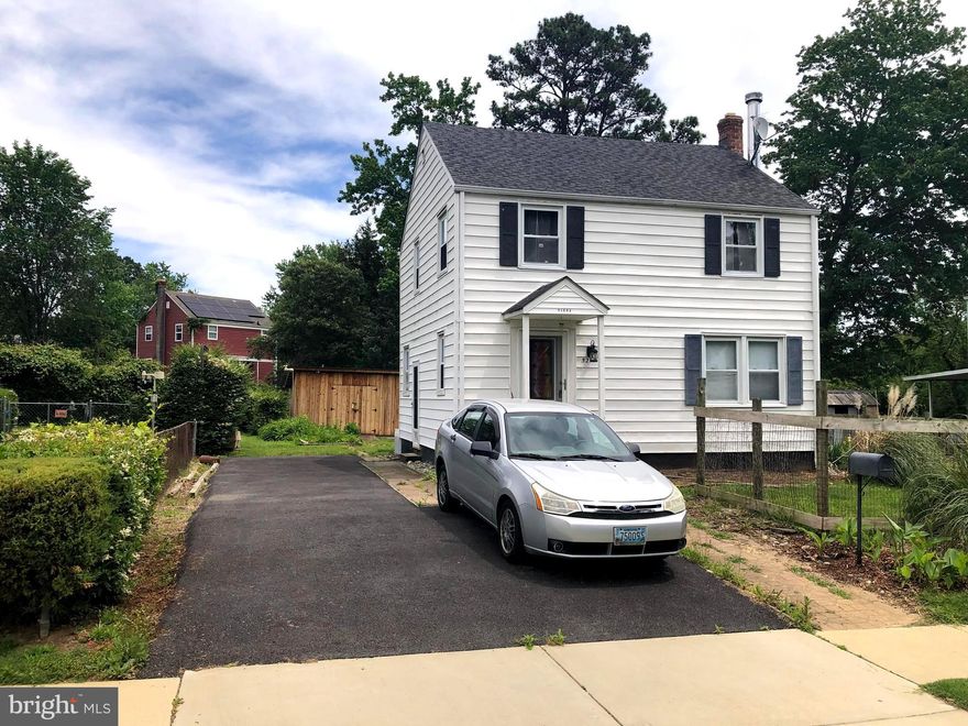 "Very Affordable"... and "Move In Ready"...  this 3 bedroom 1 bath Home in the Patuxent Park neighborhood is in Good Condition and ready for new ownership.  "SOLD AS IS" .   Owned by the same family since it was built, this property has a very nice yard for gardening, relaxing and enjoying the outdoors.  Included is a Large wooden shed for all of your storage needs.  There is a nice flat Paved driveway with parking for 3+ vehicles or an RV and has a side door entrance into the house and kitchen.  Living room has wood paneling, sitting area and a wood burning stove area with tile flooring.  Dining room has custom built in cabinets and knotty pine wood wall panels and includes table and chairs. Kitchen has upgraded countertops,  recently added refrigerator and  dishwasher, rolling island, and a gas range that needs repair or replacement.  Stairs from the kitchen lead down to the basement and laundry area and also outside to driveway.   Stairs in LR lead up to 2nd floor with 3 bedrooms and 1 full bath.  Attic access is available with pull down stairs in hallway.   NEW gas heating system installed 2024.  The Patuxent Park Neighborhood is Conveniently located to nearby County Parks and playgrounds,  Shopping,  Dining,  Entertainment, Pax River Naval Air Station and The Best that Southern Maryland has to offer.  Estate Sale. Third party Court Approval  may be required