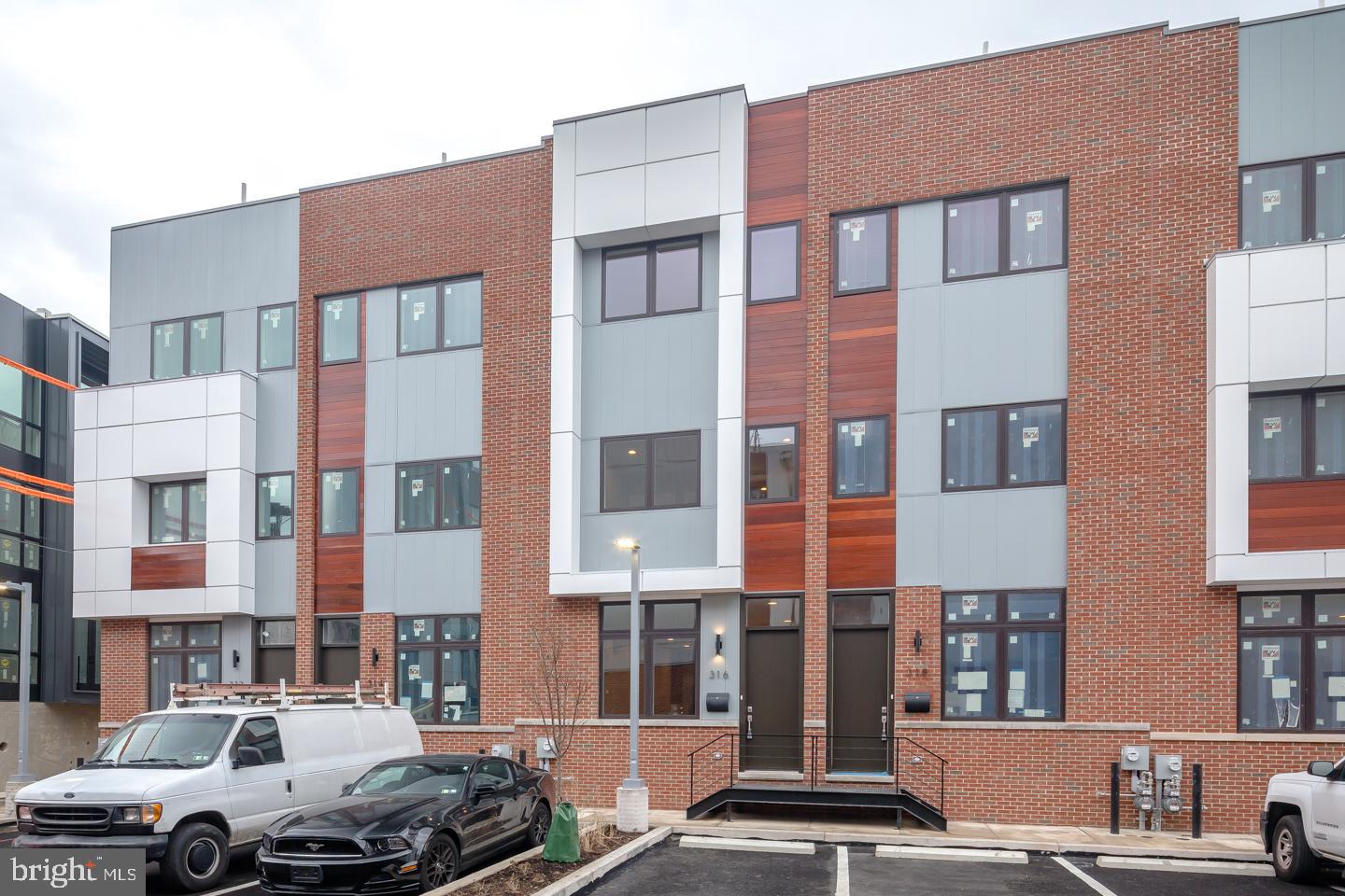 Introducing SoNo26, a premier living destination in Philadelphia?s Northern Liberties. Our unique townhomes offer an exciting opportunity to enjoy luxury living while being in the center of all the city has to offer. Stroll and shop along Liberty Walk or enjoy a gourmet meal at one of the critically acclaimed restaurants, bars and cafes. The homes at SoNo26 feature all of the high quality finishes you?ve come to expect from a Premier Access property. Step inside your front door and you will be greeted with a spacious open concept living and dining area with beautifully designed windows that offer magnificent natural sunlight. The living area flows nicely into the top of the line gourmet kitchen which features Arctic Quartz countertops, Bosch appliances and custom cabinets making this kitchen the perfect space to entertain friends. Open the sliding glass doors and you will find your back patio where you can enjoy your morning cup of coffee or glass of wine after dinner. Leading off of the kitchen are stairs to take you down to your full finished basement with washer and dryer and half bath giving you a great added space for guests or an entertainment center. Head back up the stairs and continue to the second floor where you will find two spacious bedrooms with large closets and plenty of storage as well as two bathrooms for your convenience. On the upper floor you will enter into the large master suite with incredible walk in closets and master bath with double sinks that will make you feel right at home. On the top floor you will find your unbelievable roof deck that offers spectacular views of the Philadelphia skyline making this a relaxing at home retreat. To add on to all that SoNo26 has to offer, each unit comes with 1 car parking to ensure you never have a problem finding a space for your car.