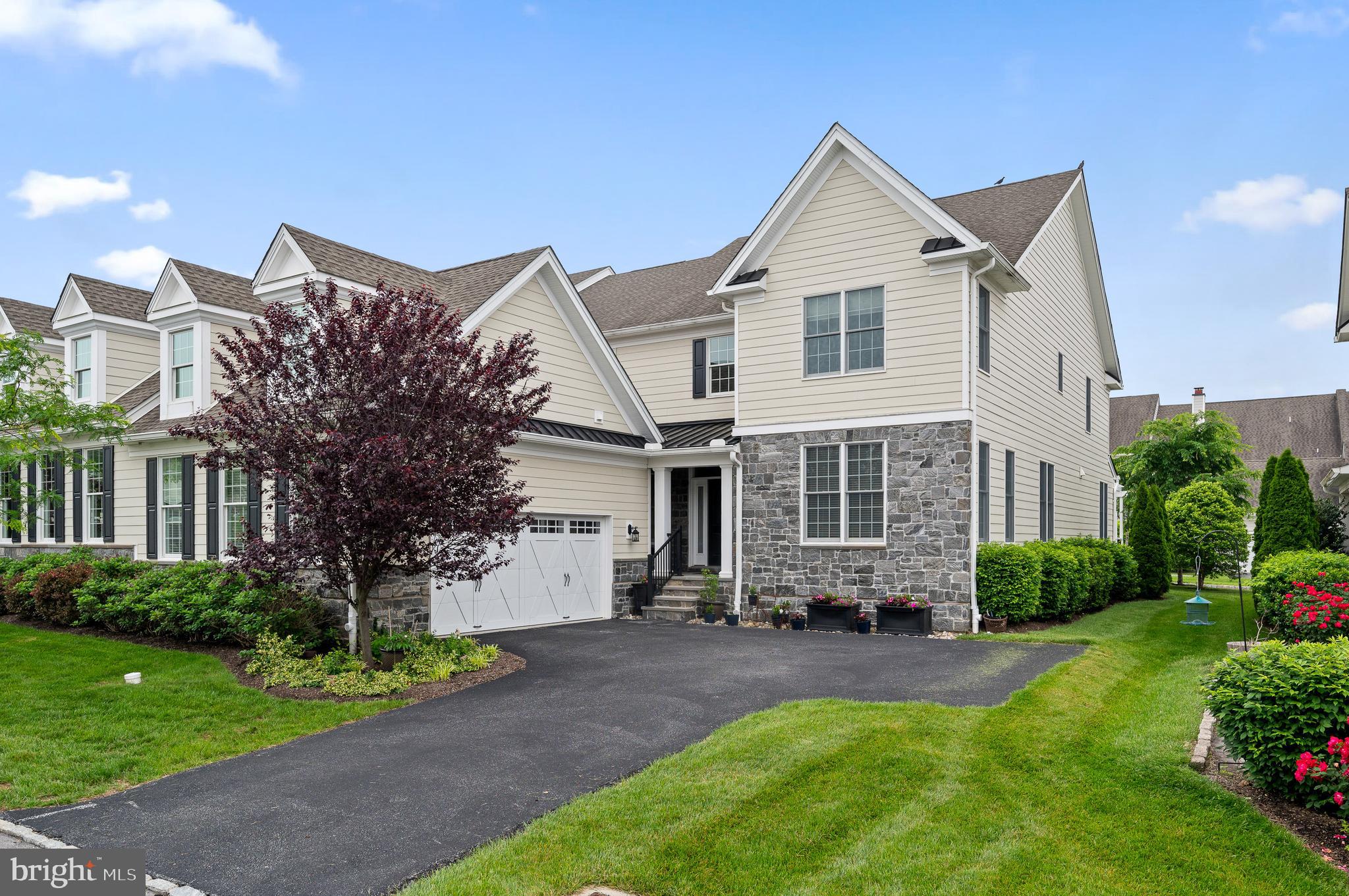 Welcome to a carefree, luxury lifestyle in this highly desirable ROSEMONT twin carriage home in the sought-after community of LISETER in Newtown Square. 3714 Rose Trader boasts a main floor primary suite for easy one floor living and an inviting open floor plan. Enter into the airy 2-story foyer with graceful curved staircase with upgraded wrought iron spindles and hardwood floors throughout. The main level is designed for both entertaining and everyday living, featuring an office, a gracious dining room with crown & chair rail moldings, and a 2-story family room with a gas fireplace and ceiling fan that seamlessly flows into the gourmet kitchen. The eat-in kitchen boasts white cabinets, stainless steel appliances, spacious island, quartz countertops, and separate pantry. Off the breakfast room is a slider to the Trex deck with pergola, a perfect place for al fresco dining. The main level features the primary suite, including a large bedroom with ceiling fan, triple windows, walk-in closet and primary bathroom with double vanity with quartz countertops, stall shower and separate water closet. A half bath and attached garage complete this floor. The second level features 2/3 bedrooms and a hall bathroom. There are 2 nice-sized bedrooms with large walk-in closets and a third bonus room that can be used as a 4th bedroom, playroom or music room. The unfinished basement is huge and pre-plumbed for a full bathroom, creating endless possibilities. The 2 car garage has been extended, allowing for more storage. The Liseter community boasts country club amenities: a gym within the clubhouse, tennis & pickle ball courts, bocci ball, infinity edge pool, open air pavilion, walking trails, and a 6000 sq. ft. award winning barn for social gatherings. Conveniently located next to the prestigious Episcopal Academy and close to the vibrant towns of Wayne and Newtown Square with Whole Foods and the new shops and restaurants at Ellis Preserve. Great Marple Newtown Schools!