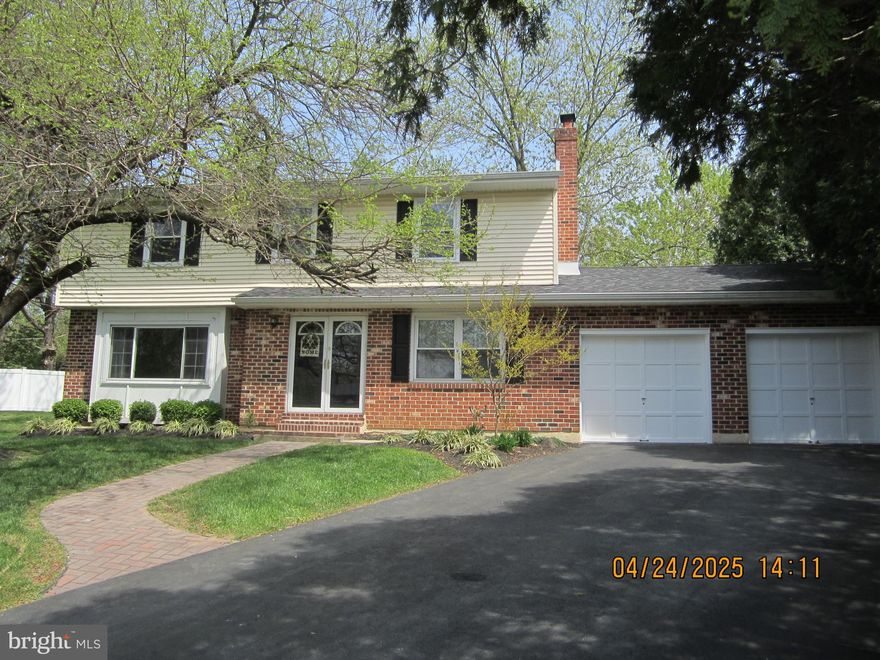 Move right in to this stately 2 story, 5 Bedroom, 2 1/2 Bath property boasting upgrades throughout,  situated on a peaceful cul-de-sac.   As you approach the home, you'll first notice a beautiful landscape design surrounding the brick and vinyl-sided Colonial and a 4-car driveway.  Enter through double doors into the foyer with a stunning marble floor inlay. Continue straight into the ceramic-tiled, gourmet kitchen complete with all wood cabinets, center island, granite countertops, microwave cabinet, wine storage cabinet and generous pantry storage.   The eastward facing kitchen window  allowing natural morning light.  To the right of the kitchen and foyer is the inviting family room with luxury vinyl plank flooring, all brick, wood burning fireplace and bay window.  Behind the family room is a spacious laundry room with a utility sink setup for washer and gas dryer.  To the left is the powder room and to the right is the bonus hobby/crafts room/living area.  The living space expands into the converted garage space complete with large 1st floor bedroom, spacious closet, separate office/den, storage room, and access to the backyard patio. Also on the 1st floor to the left of the foyer is an inviting formal living room with a large picture window, luxury vinyl plank flooring,  and a dining room lit with a decorative chandelier.  Exit the dining room through glass french doors into your  screened-in-porch.  Added in 2023, the outdoor oasis is completely screened, including under the flooring. Adjacent to the porch is the large newly completed deck, also completed in 2023, which overlooks the spacious backyard . Step down off the deck to your finished patio area with a view of the playground area.  The 2nd floor of this home includes a large master suite with walk in closet, separate sitting area and a tastefully finished master bath.  There are 3 additional spacious bedrooms with ample closet space, large hall bathroom and pulldown stairs to the attic for additional storage space. The large basement area is partially finished, protected by a french drain.  Mechanicals in the basement include the recently updated electrical panel  to 200 amp service with the transfer switch for the whole house Generac generator system newly installed in 2020. Never lose power again! The roof was installed in 2016.  Easy to show.