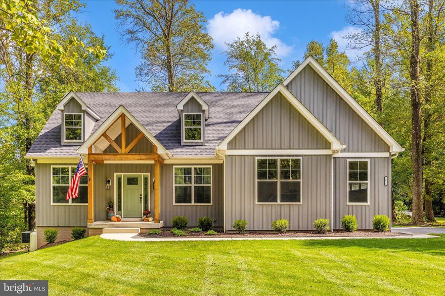 This is the home where weekend hikes, orchard runs, and back-porch coffee feel like your new normal.

Imagine stepping out your back door straight into Pryor Orchard, fresh peaches in summer, apples in fall, the kind of farm-to-table living that feels like a luxury you didn't know you needed. This 2022-built modern home on a partially wooded acre is where elevated design meets the ease of country living, just minutes from Catoctin Mountain Park's waterfall trails and Highway 15.

Inside, rich hardwood floors flow through sun-drenched spaces with a gas fireplace and a hand-hewn mantel reclaimed from a local barn. The chef's kitchen features a gas cooktop and stainless appliances, while oversized windows throughout flood every room with natural light. The main-floor luxury bill payer suite provides a large walk-in closet, soaking tub, double sinks, tile shower and private water closet. A second full bath and flex room (currently a home office, perfect as a guest bedroom) also on the main level.

Upstairs, two generous bedrooms each with walk-in closets and share a third full bath with tile shower. Tucked between them? An insulated secret storage room that can be finished into your future reading nook, dog sanctuary, or the place you hide the good snacks. (We won't tell.)

The unfinished walkout basement is a blank canvas with bathroom rough-in already in place. Think home gym, media room, or game space. Outside, the spacious back porch with built-in speakers is made for long evenings and easy entertaining, while the property comes turnkey with LeafFilter gutter guards, underground dog fence, and storage shed in place.