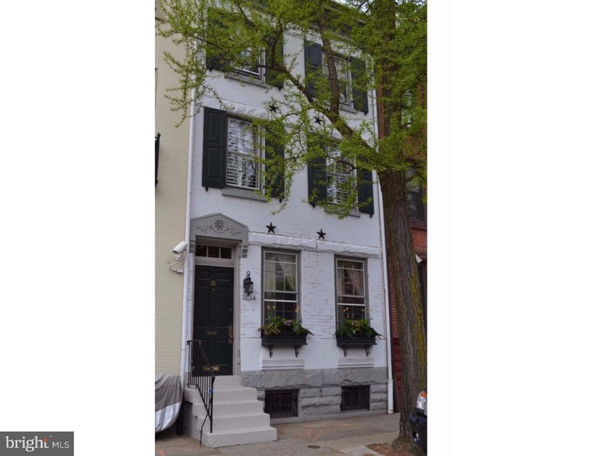 Welcome to 1634 Pine Street! With a one-car detached garage, rear slate patio, roof deck, finished basement, and updated kitchen and bathrooms, this gorgeous Rittenhouse Square townhome is everything you've been looking for and more! As you enter into and through the tiled vestibule, you'll notice the beautiful preserved woodwork throughout. The living room with inlaid hardwood floors, crown molding, and gas fireplace opens up into the dining room with impressive woodwork, exterior glass door, and is next to the convenient first floor powder room. The bright and updated kitchen includes a stainless steel Wolf range/hood, LG refrigerator, subway tile backsplash, cork floors, recessed lighting, granite counter tops, and a vaulted breakfast room with skylights overlooking the rear slate yard / patio / garden area (which includes access to the 1-car detached garage with carriage-style door). The second floor of the home includes two generously-sized bedrooms (both connected and both with ample closets) and a recently updated hall bathroom with double vanity, subway tile, and linen closet. The third floor of the home features the master bedroom with 8 closets, recessed lighting, plantation shutters, and access into the master bathroom with farmhouse-style sink, frameless glass shower, heated floors, and laundry area. Also included on this level is access to a deck with spiral staircase leading to the main roof deck. The fourth floor of the home is used as an office with access to the roof deck with amazing panorama views. The basement is finished with a powder room. Other notable features of the home include: newer roof, Hunter Douglas window treatments, a 7-zone high-efficiency HVAC system, and the potential to build on top of the garage facing Waverly Street (see agent for plans). With a walk-score of 99 and close to center city restaurants, shopping, entertainment, and more, this home is truly a must-see!