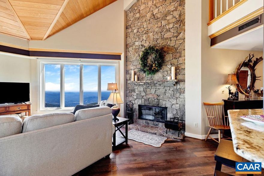 This stunning 4 bedroom view condominium is a rare opportunity, as few exist and aren't often available.  The villa rests at the top of the building and offers elevator access for ease and convenience.  Covered entry keeps you out of inclement weather upon arrival.  Stepping inside, you'll find the property has been beautifully remodeled and tastefully furnished.  A wood-burning, custom stone fireplace soars high into the vaulted ceilings.  Large wall of windows in the living room allows the sunrises and mountain views to spill into the space.  New composite decking.  LVP flooring.  Kitchen with granite and stainless steel appliances.  Out of the 4 bedrooms in total, 3 of them are en-suite bedrooms upstairs, with one master bedroom on the main level as well.  There's also a study/office on the main level, which could be utilized as a 5th bedroom.  Excellent year round location, with easy access to golf, tennis, dining, spa and exercise facilities, hiking, etc.  On the shuttle route for convenience to skiing in winter as well.  Detached homes with this view easily require a 1.5-2 million budget, making this property an easy choice in comparison.  Turnkey, furnished and ready to be enjoyed.  Don't miss this rare opportunity.,Granite Counter,Oak Cabinets,Fireplace in Living Room