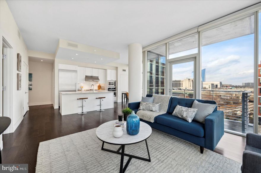 Experience unparalleled luxury at the prestigious, award winning One Riverside Condominiums! Revel in the boundless, panoramic views of the Philadelphia skyline and river through the expansive, floor to ceiling windows of this exceptional 2-bedroom, 2.5-bathroom home. Picture yourself walking up to this stunning building, nestled in the tranquil enclave of Fitler Square, while being mere moments from the dynamic pulse of Rittenhouse Square Park with its vibrant culinary scene. This unit includes a dedicated parking space and the advantage of a 10-year tax abatement, ensuring meaningful financial savings through 2027. The expansive design is adorned with luxurious finishes and a private balcony, seamlessly blending sophisticated interiors with the enchantment of outdoor leisure, perfect for entertaining or relaxing. The residence is further enhanced by bespoke automated Lutron shades throughout, adding a sumptuous touch of privacy and refinement. The master suite is a radiant sanctuary, equipped with meticulously designed storage solutions to satisfy your organizational desires. The master bath is a spa-like retreat featuring double sinks, a voluminous walk-in shower, and a decadent soaking tub for the ultimate relaxation. The bright, open-plan living area boasts elegantly polished wooden floors, lofty ceilings, and transitions into a gourmet kitchen fitted with Miele appliances, a Sharp microwave, lustrous white cabinets, and meticulously polished marble countertops. Whether hosting or enjoying a serene morning, the kitchen island is the perfect perch to indulge in the awe-inspiring views or step out onto the balcony for an unparalleled sunset spectacle. The guest bedroom mirrors the master suite’s opulence, offering sophisticated decor, abundant storage, and a private bath. A convenient half bath by the entrance houses laundry facilities, adding supreme ease to your daily living. Reside in an iconic building with 24/7 concierge service, an indoor lap pool, sauna, steam room, boardroom, business center, an expansive fitness center, verdant gardens, and an outdoor patio equipped with grill, fridge, ice maker, fire pit, and TV, along with a guest suite for visitors. Enjoy the luxury of complimentary on-demand transportation with the building's exclusive Town Car and a sophisticated mobile app to streamline deliveries, guest visits, and community engagement. Just a short walk from Schuylkill River Park and Trail, linking directly to the Art Museum and Kelly Drive, the location is superbly close to the University of Pennsylvania, HUP, Drexel, 30th Street Station, Comcast Towers and a selection of Philadelphia’s finest shops, restaurants, and parks. With convenient access to major landmarks and amenities, the location represents a tranquility married with urban sophistication and access that cannot be matched in Philadelphia.