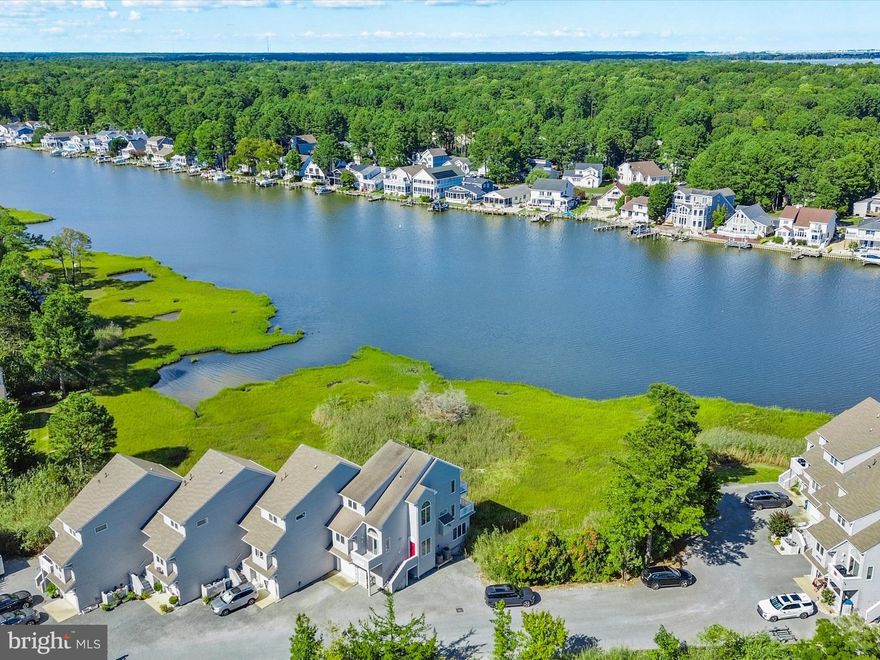 Water , Water Everywhere .....  

This exceptional three-story waterfront end-unit townhome in the sought-after Salt Grass Cove section of Ocean Pines offers stunning water views of Manklin Creek from every room. The residence features three bedrooms, three and a half bathrooms, three private balconies, and two primary suites.
The third-level primary suite includes a private balcony, walk-in closet, jetted tub, and stall shower while the entry-level suite provides flexibility for guests or multigenerational living. The spacious open-concept family room boasts vaulted ceilings, a gas fireplace, and access to a large balcony overlooking the water. A bright and inviting eat-in kitchen offers its own balcony, perfect for enjoying morning coffee with a view.
Additional highlights include a central vacuum system and an oversized garage with ample storage and a utility sink. Set in a peaceful, private location within the gates of Ocean Pines, residents can enjoy the community’s extensive amenities while appreciating the quiet waterfront lifestyle. Best of all, this property comes with no condo fees.
This community has it ALL -  for additional community information and amenity photos 
 go to :  
oceanpines.org