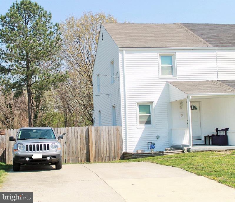 Bright and spacious move-in ready home. Peacefully situated, this home is within walking distance of major stores and shopping centers. Only two (2) minutes to Beltway I-695, ten minutes (10) to BWI Airport and train station, and thirty (30) minutes to Washington, D.C. Victory Drive is a one-way street that allows for privacy and lightly controlled traffic. Never search for a parking space as there is a four (4) car parking pad within 20 feet of your front door. A privacy fence between your parking pad and backyard allows for a yard comparative to a park-like setting. Plenty of room to throw a ball to your dog, build a playground and exercise area, as well as room for a pool. The roof on the home as well as the garage is less than three (3) months old. Home interior, as well as exterior and garage, have been freshly painted. Garage door is new. This inviting 2 bedroom, 1 1/2 bath home is immaculate and full of upgrades. Central Air and Furnace less than four (4) years old. Hardwood on first and second floor. Updated kitchen leads to relaxing sunporch or play space. Possible third bedroom in basement. Walk out from basement leads to the backyard.