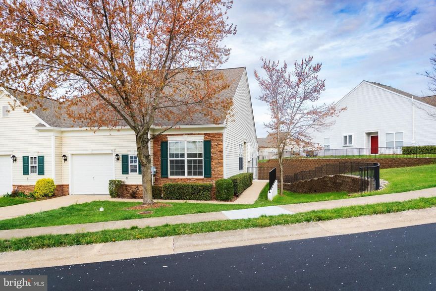 Welcome to this beautiful Janssen model end-unit villa in The Villas at Falls Run! Freshly painted and newly carpeted, this 3-bedroom, 3-bath home features brand-new French doors on the main level and new patio doors on the lower level. Enjoy an eat-in kitchen, formal dining room, sunroom, great room, and a finished lower level with a family room, hobby room, and large utility space perfect for a home gym or workshop. Step out onto your private patio and relax with views of trees and greenery. Community amenities include a clubhouse, pools, tennis, pickleball, and a fitness center. Lawn care and snow removal included! Move-in ready and waiting for you!