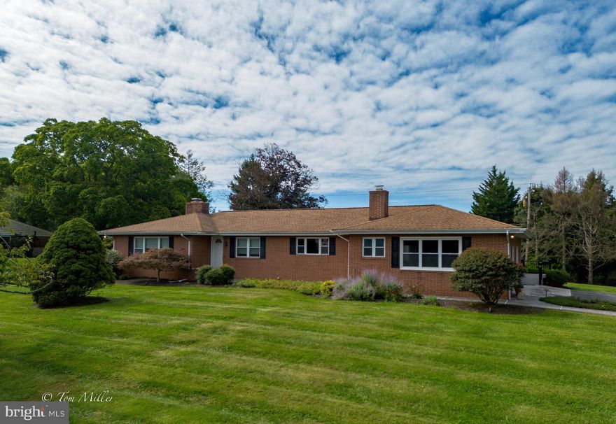 Beautifully updated rancher on fantastic lot in the sought after neighborhood of Pot Spring. The kitchen - breakfast room - family room is a show stopper - a must see!  Spacious sunroom off family room with its own entry door has several options. Beautiful flooring thru-out including hardwoods in living room, dining room, familly room & both bedrooms. Well appointed kitchen with granite countertops,  GE Profile stainless steel appliances, gas cooktop - double wall oven, custom cabinets, ceramic flooring and kitchen desk.  Wood burning fireplace in living room, and gas fire place in family room.  Sizeable cedar closet off family room. Oversized garage has several extra storage space closets, and there is a  whole house generator.  The rear yard is level and very nicely landscaped.  Looking for a cluster home without the cluster?  This is it!