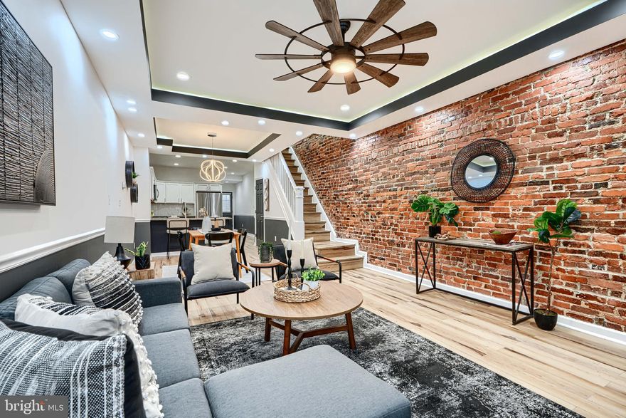 Welcome to 1609 E 30th Street — this home truly has it all. Upon entry, you’ll be greeted by oak-tone luxury vinyl flooring throughout the main and upper levels. The home features elegant tray ceilings with accent lighting, complemented by recessed lighting throughout.

The gourmet kitchen boasts stainless steel appliances, two-tone cabinetry, and granite countertops. Just off the kitchen are a convenient powder room, laundry area, and access to the rear deck.

The upper level offers two bedrooms plus a bonus room and two full bathrooms, including a spacious primary suite. The fully finished basement provides two additional bedrooms and a full bathroom, offering plenty of space and flexibility.