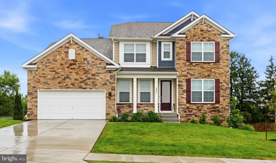 Welcome to Cider Mill, one of Westminster’s premier luxury communities. This stunning Colonial offers over 4,400 square feet with 6 bedrooms and 4 baths, blending timeless style with modern comfort.

The beautiful stone and siding exterior, inviting front porch, two-car garage, and professional landscaping create exceptional curb appeal.

The main level welcomes you with impressive 8-foot doors and rich design elements throughout. An adjoining flex room or tucked-away private study provides ideal versatility for working from home, a reading lounge, or formal living space. The elegant dining room is accented with crown molding, creating the perfect backdrop for elevated entertaining and special gatherings.

At the heart of the home lies a striking gourmet kitchen featuring quartz countertops, a center island, stainless steel built-in appliances, double ovens, a spacious corner pantry, and an expansive butler’s pantry with additional storage. The open-concept layout flows effortlessly into the generous living room, where serene views of the private backyard create a warm and inviting atmosphere. Sliding glass doors extend the living space outdoors, offering the perfect indoor-outdoor connection for entertaining and everyday enjoyment. A main-level bedroom and full bath provide additional flexibility for guests or multigenerational living.

Upstairs, you’ll find a spacious loft, an oversized laundry room, and a luxurious owner’s suite with its own sitting room, large walk-in closet, and spa-inspired bath featuring dual vanities, a soaking tub, a separate shower, and a private water closet. Three additional bedrooms share a full hall bath, completing the upper level.

The finished walkout lower level offers even more living space with a large recreation room, a media room, one additional bedroom, a full bath, and unfinished storage with epoxy flooring.

Additional luxury highlights include quartz countertops in all bathrooms, updated ceiling fans throughout, a radon mitigation system with alarm, hard-wired Ethernet and coaxial connections in every bedroom, and an attached two-car garage. You have to see it to believe it, come take a tour!