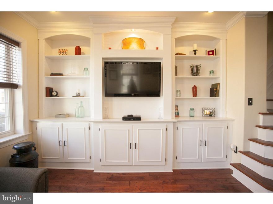 Truly handsome renovated home on a sunny corner lot.  Upon entering you will be wowed by the beautiful custom built-ins and striking staircase.  Pass through the comfortable living room and dining room to the extra large kitchen with lots of storage, granite countertops and stainless steel appliances.  The 2nd level of the home contains a great master suite with large closets and a private bath with beautiful tile work.  A second bathroom and another large bedroom are also located on this level.  The third floor contains two more sizable bedrooms and a third bathroom.  A powder room is located on the main level, and a semi finished basement houses the washer/dryer.  Of course you can't beat the location with all of great entertainment that Fishtown has to offer.