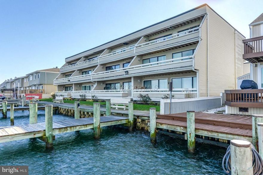 Stunning Full Bay Views!  Investors, you can change the inside but not the view.  Extra large balcony, 2 bedrooms, 2 full baths and outdoor POOL with neighborhood block parties or quiet time. Plus a private association tennis court and storage closet.  Great locations to walk or bike to beach, restaurants and close to jolly Rogers Amusement Park, boardwalk and shopping.