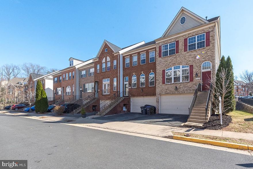 Don't miss out SUN FILLED End Unit townhome! Freshly Painted, New Carpet and designer light fixtures .Make your appt to see this Beautiful Turnkey End unit.  This Pride of Ownership home has 3 bedrooms, 3.5 bathrooms, & 2 car garage. Floors have been upgraded to beautiful Laminate floors throughout the Main Level & 3rd level Bedrooms and hall . The walkout Basement, has durable tiles & is nicely finished with a built in Ikea Entertainment Center (that convey), a Fireplace, & a Full bathroom. There are 2 doors that lead to the paved fenced patio. The main floor sits on the 2nd level. You walk into the Open and Bright Livingroom & Formal Dining & a 1/2 bath. The Kitchen and Breakfast/2nd sitting area are located towards the back. The Open Kitchen boasts upgraded cabinets and granite counter tops, Gas stove top, built in Microwave and Oven, & a built in desk. The Large kitchen Island has room to set stools for extra seating. The extra Breakfast space can also be used as a sitting area where you can cozy up to the 2nd fireplace. Yes, I said 2nd fireplace. From the sitting space you can walk out the sliding door onto the deck where you can enjoy the view of the Community Pool. The Master bedroom has its own master bath with shower and separate large tub. And yes it has a walk in closet. To make Laundry a breeze you will find the Washer & Dryer on this level. The 2nd, 3rd bedroom and 3rd bathroom are on the other side of the hall. A/C & Furnice replaced 2020. Ample Free Parking available. VRE is within walking distance or a 2 min drive! Train is about a 1hr commute into L'Enfant in DC. You will love the privacy of this community and the closeness to shopping off Liberia. 10 min drive to Manassas Mall, 15 min to Centreville, 20min to Fairfax, 20min to Woodbridge. About 30 min to Dulles & only 30 min to Orange Metro Nutley exit.