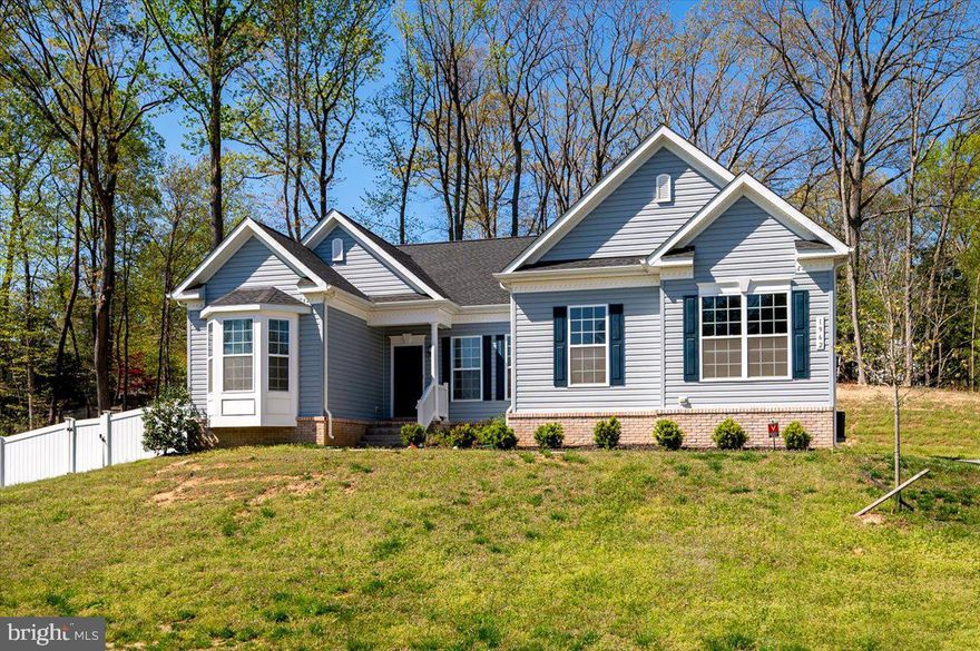 Welcome to 1962 Foxwood Lane—a nearly new, 3,404 sq ft contemporary colonial nestled on a serene 0.82-acre lot in the desirable Foxwood community of Lusby. Built in 2021, this meticulously maintained home offers a harmonious blend of modern design and comfortable living.  Retreat to a generous primary bedroom featuring an ensuite bathroom with a large corner garden tub, separate glass-enclosed shower, and dual vanities. Culinary enthusiasts will appreciate the large, gourmet kitchen with stainless steel appliances, center island, breakfast bar, pantry and ample counter space adorned with black Ubatuba granite.​ Nine-foot ceilings and LVP flooring span the first floor, complemented by crown molding and decorative wainscotting in the hallway and dining room.​  The fully finished walk-up basement boasts a media room, additional bedroom and bathroom, and abundant storage space, all enhanced by nine-foot ceilings and slider door windows. The very large, open rec room space, has so many possibilities.  With the basement, you can enjoy the best of one level living most days and still have plenty of space for those times you would like to entertain family and friends.   Enjoy the fenced-in yard, deck, and patio—perfect for entertaining or relaxing in a private setting.​  Let's not forget about the oversized two-car garage with ample guest parking in the driveway.  This home is only 4 years young! Which means, the HVAC, the appliances, the water heater, the roof and all the other important structural and mechanical items are very young!