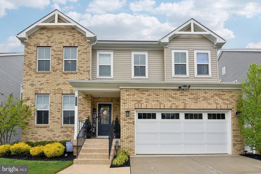Welcome to the most custom home in Jessup.  Located in Magnolia Creek, this beautifully upgraded brick-front colonial offers over 3,900 square feet of finished living space on a private lot that backs to woods. The first thing you will notice is the custom epoxied driveway and entry leading to this impressive home. The main level features a private study, a spacious great room with a fireplace, and an open concept kitchen and dining area designed for everyday living and entertaining. The kitchen is beautifully appointed with granite countertops, upgraded KitchenAid appliances, and 64-inch cabinetry. Just off the main living area is a large custom-built composite deck overlooking the immaculate backyard.

Upstairs you will find three generous bedrooms and a spacious loft that makes the perfect upper-level living room, home office, or flex space. The owner's suite has been thoughtfully updated and features two walk-in closets with custom built-in organizers. One closet was created from a previous bedroom and could easily be converted back to a fourth upper-level bedroom. The suite also features a tray ceiling and a spa-like en suite bath complete with a soaking tub and custom shower.

The fully finished lower level is an entertainer's dream.  There is a lower-level bedroom and a full bath, perfect for guest. The rec room is spacious and features a custom wet bar made for hosting and entertaining.  This home features your own private movie theatre complete with risers, 120inch screen and complete audio/visual hook equipment. Outside you will find extensive hardscaping including a patio with built-in fire pit and seating area, hot tub, and a low-maintenance turf lawn. Completed with a finished two-car garage and fully fenced backyard, this thoughtfully upgraded home leaves nothing to be desired. Conveniently located near major commuter route 295, this home makes an easy drive to Fort Meade, NASA and DC.